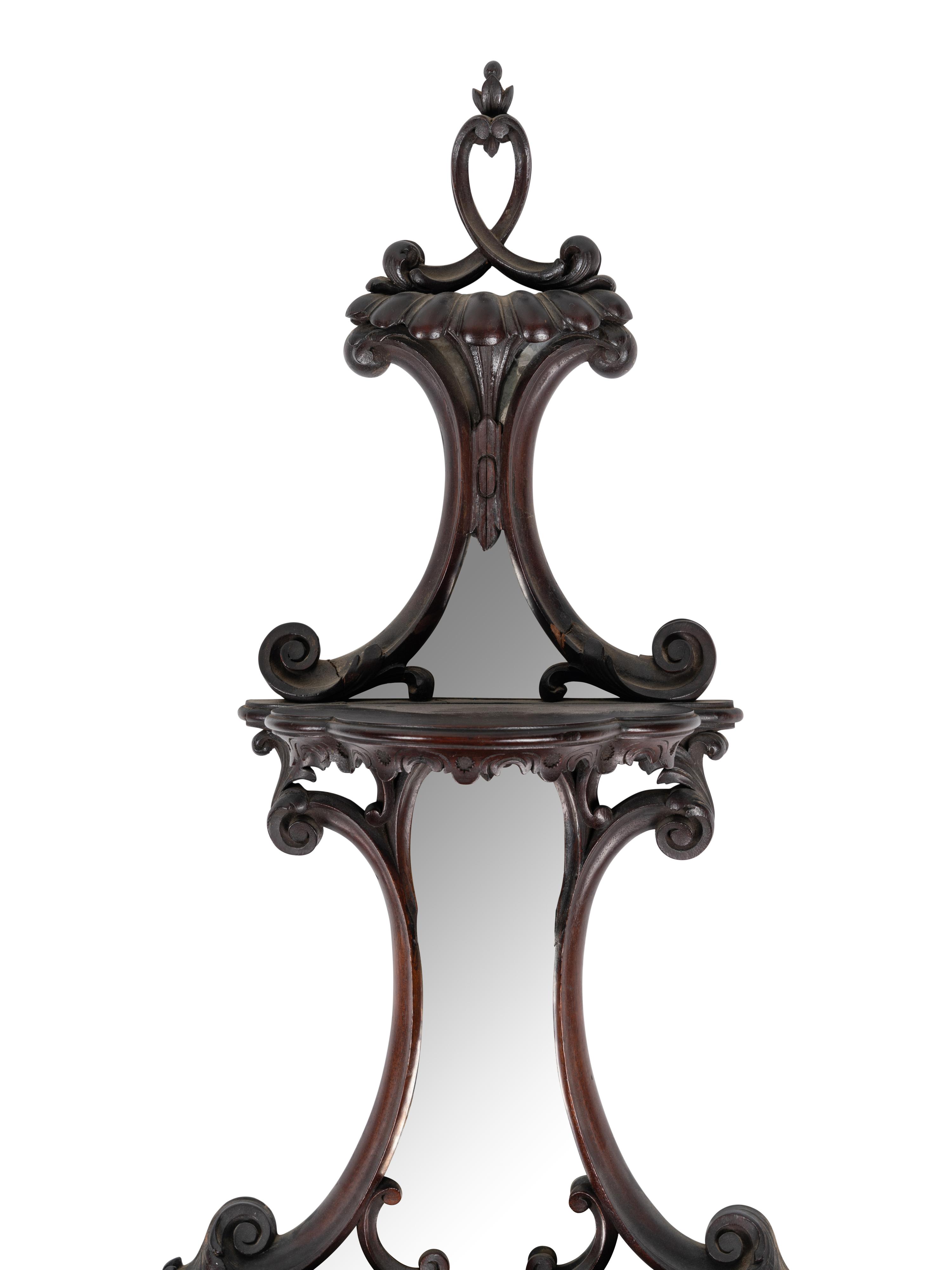A Pair of George III Style Mirrored and Carved Mahogany Wall Brackets