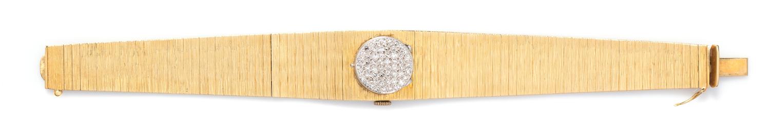 An 18 Karat Yellow Gold and Diamond Surprise Watch, Desky, 32.60 dwts.
