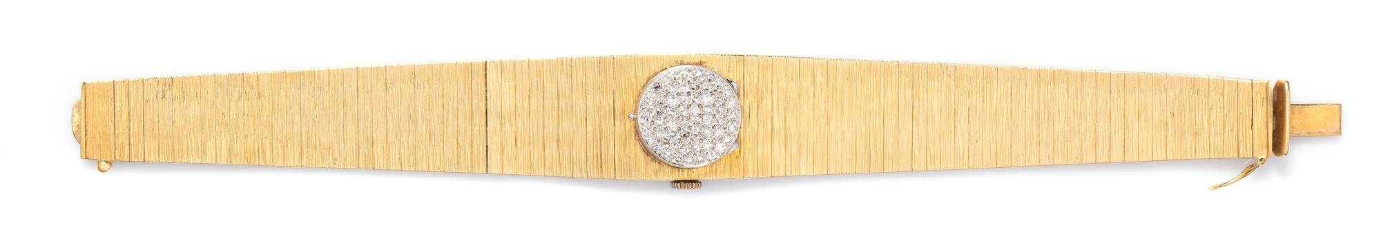 An 18 Karat Yellow Gold and Diamond Surprise Watch, Desky, 32.60 dwts.