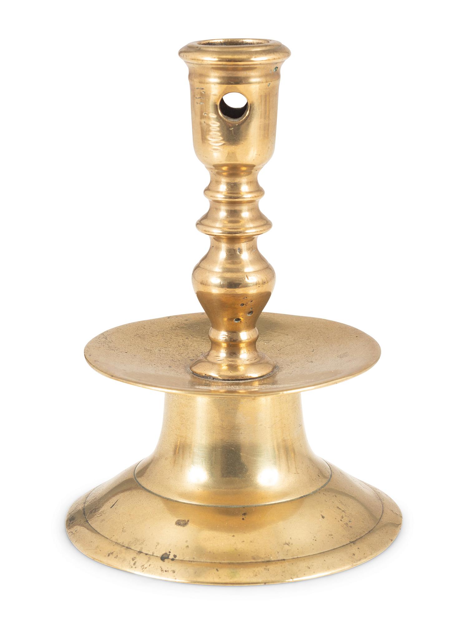 A Continental Brass Heemskirk Candlestick