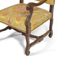 A Pair of Louis XIV Style Carved Mahogany Fauteuils