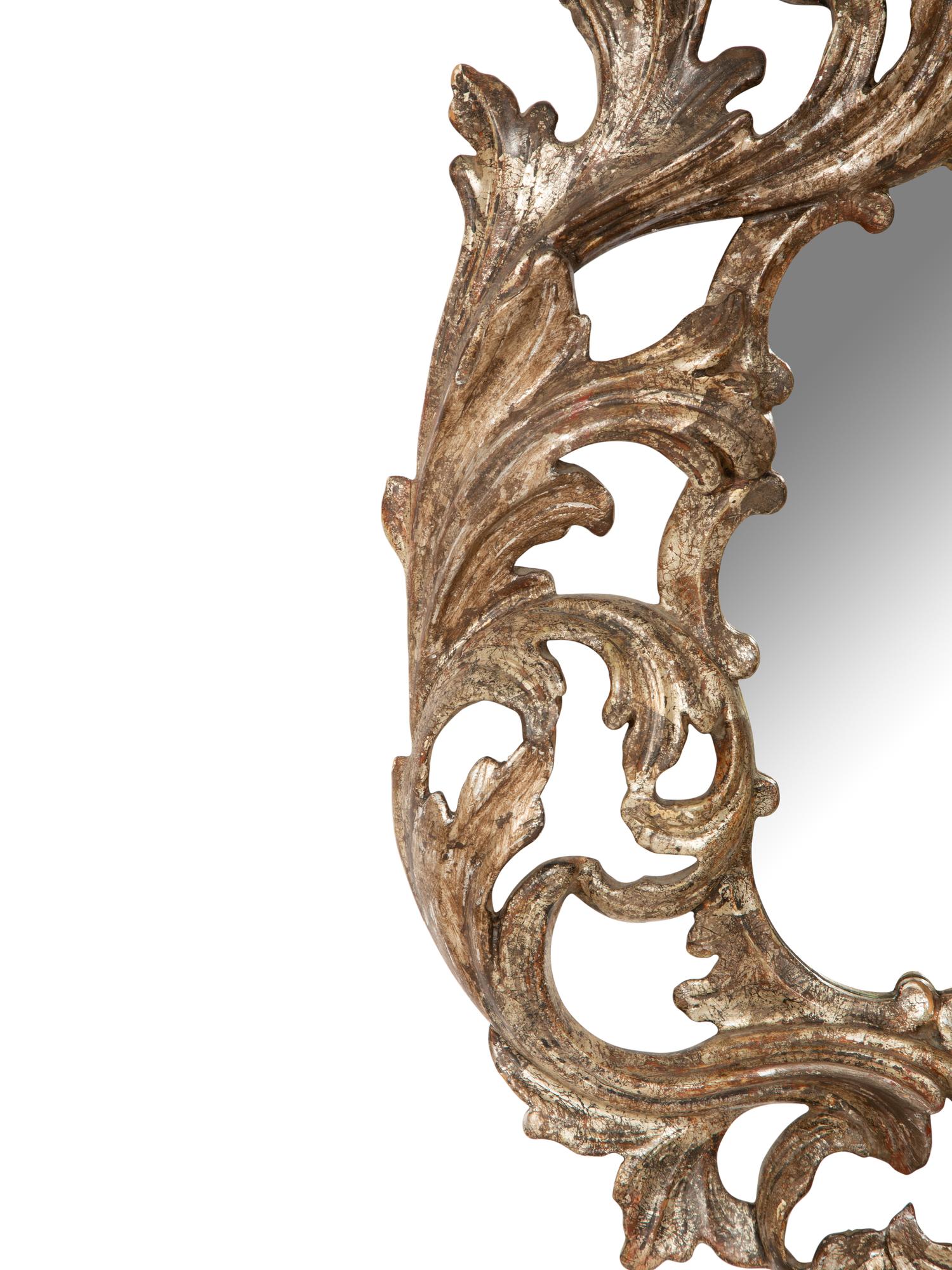 An Italian Baroque Style Silvered Wood Mirror