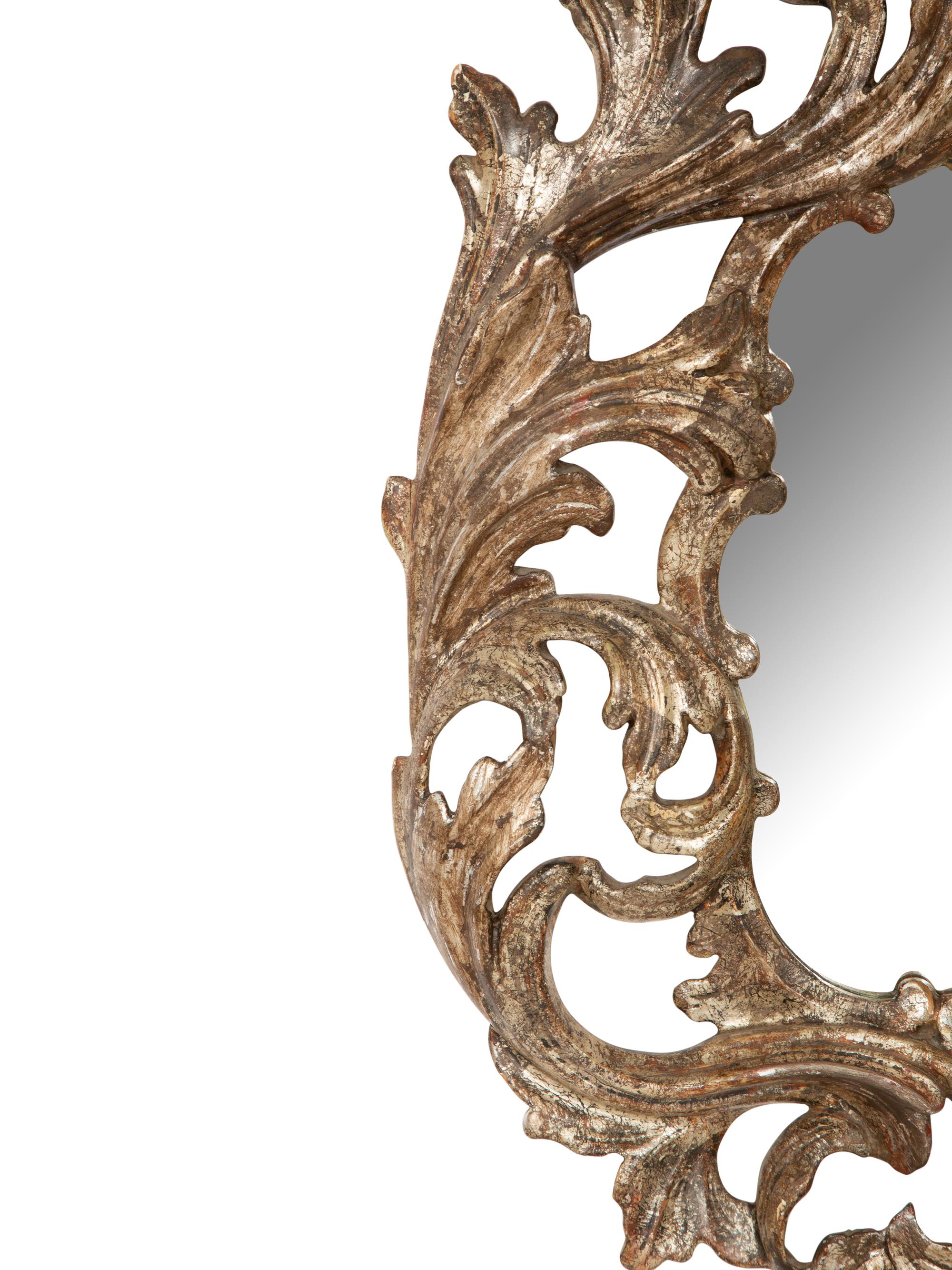 An Italian Baroque Style Silvered Wood Mirror