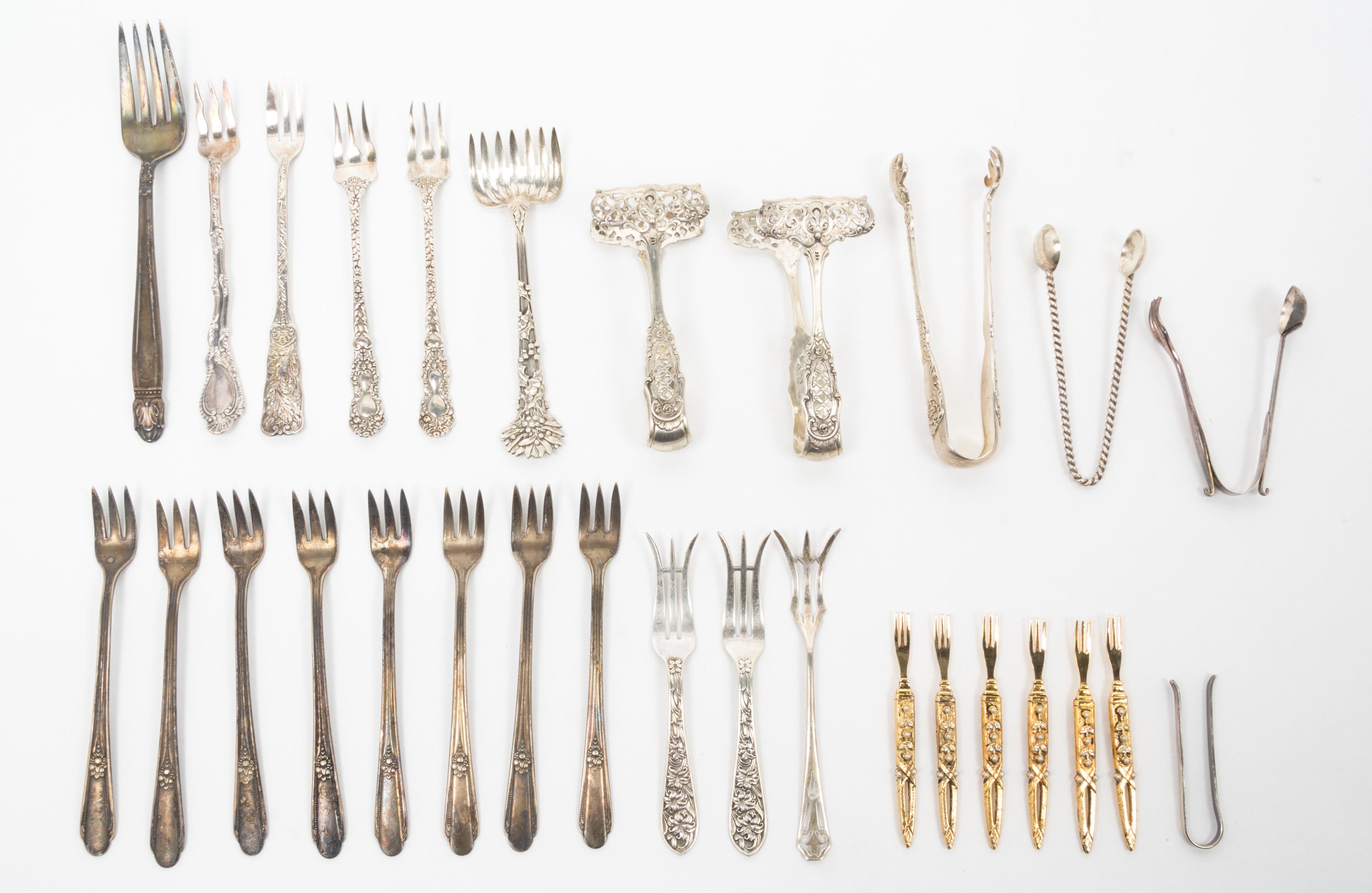 A Group of Silver-Plate Flatware Servers Length of longest 13 1/2 inches.