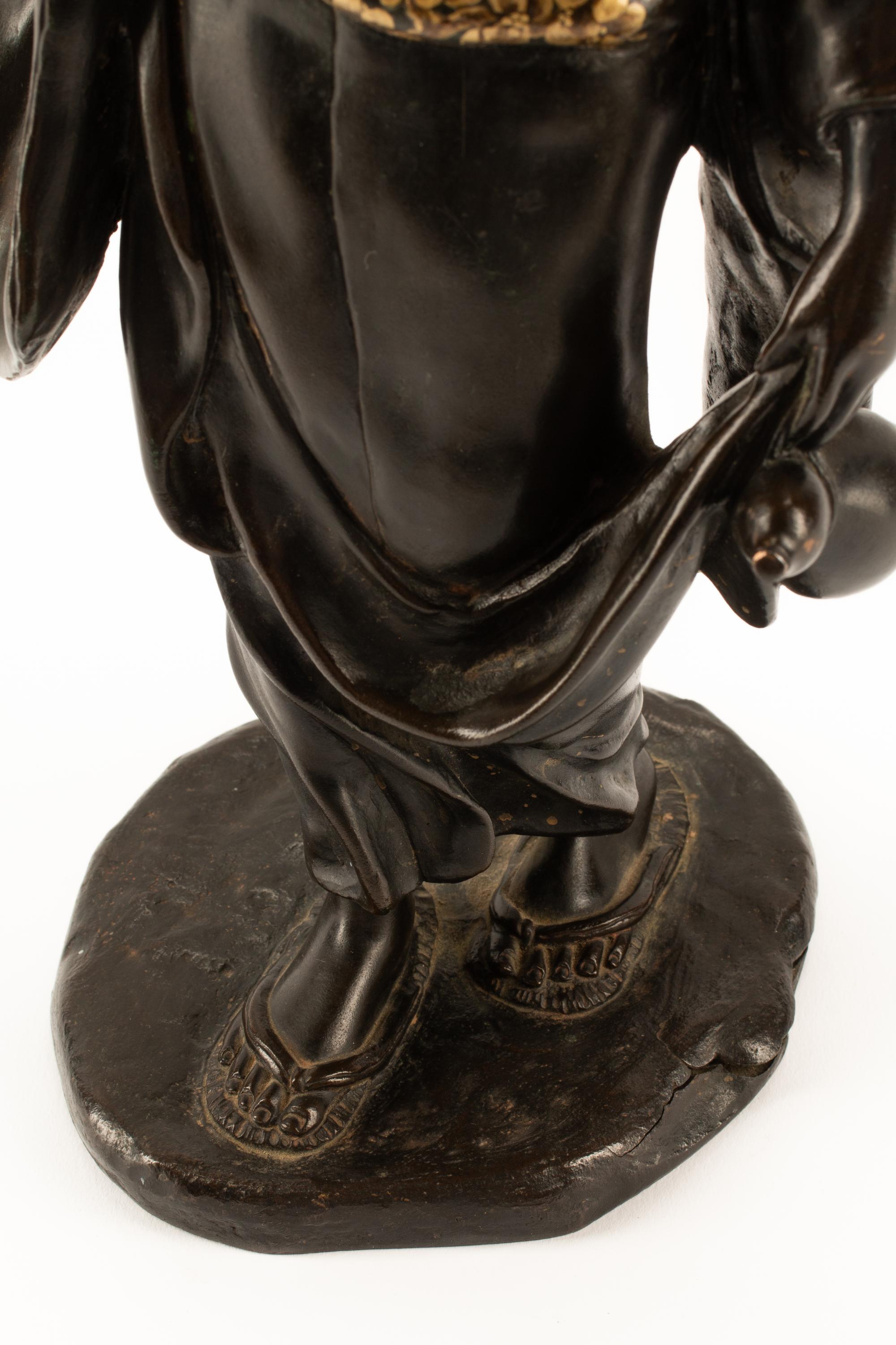 A Japanese Parcel Gilt Bronze Figure of a Lady