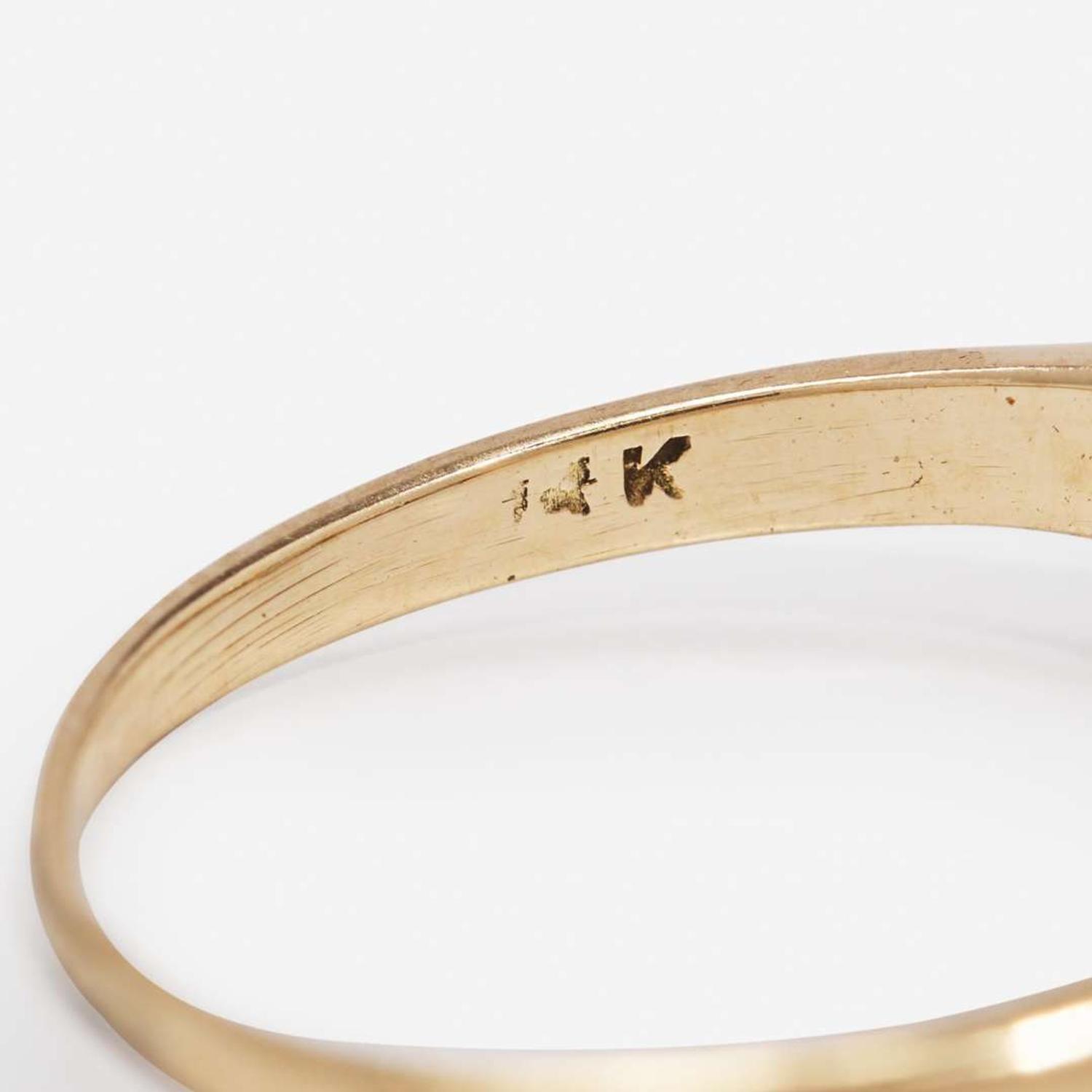 A Ladies 14K Gold and Diamond Ring