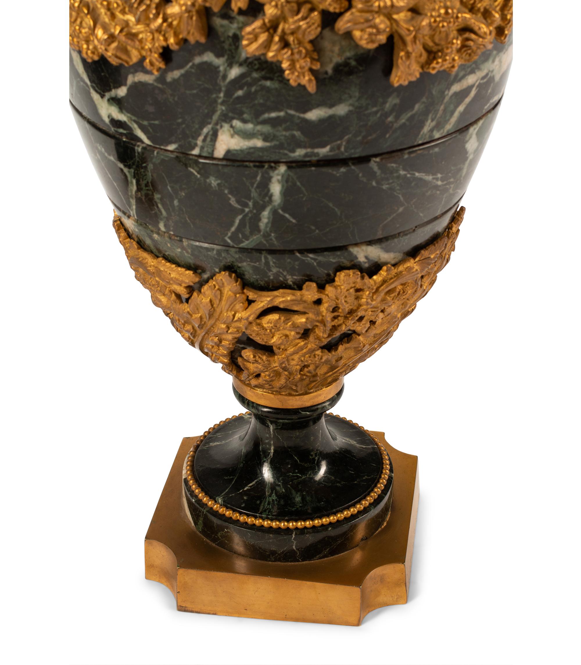 A Pair of French Gilt Bronze and Marble Urns