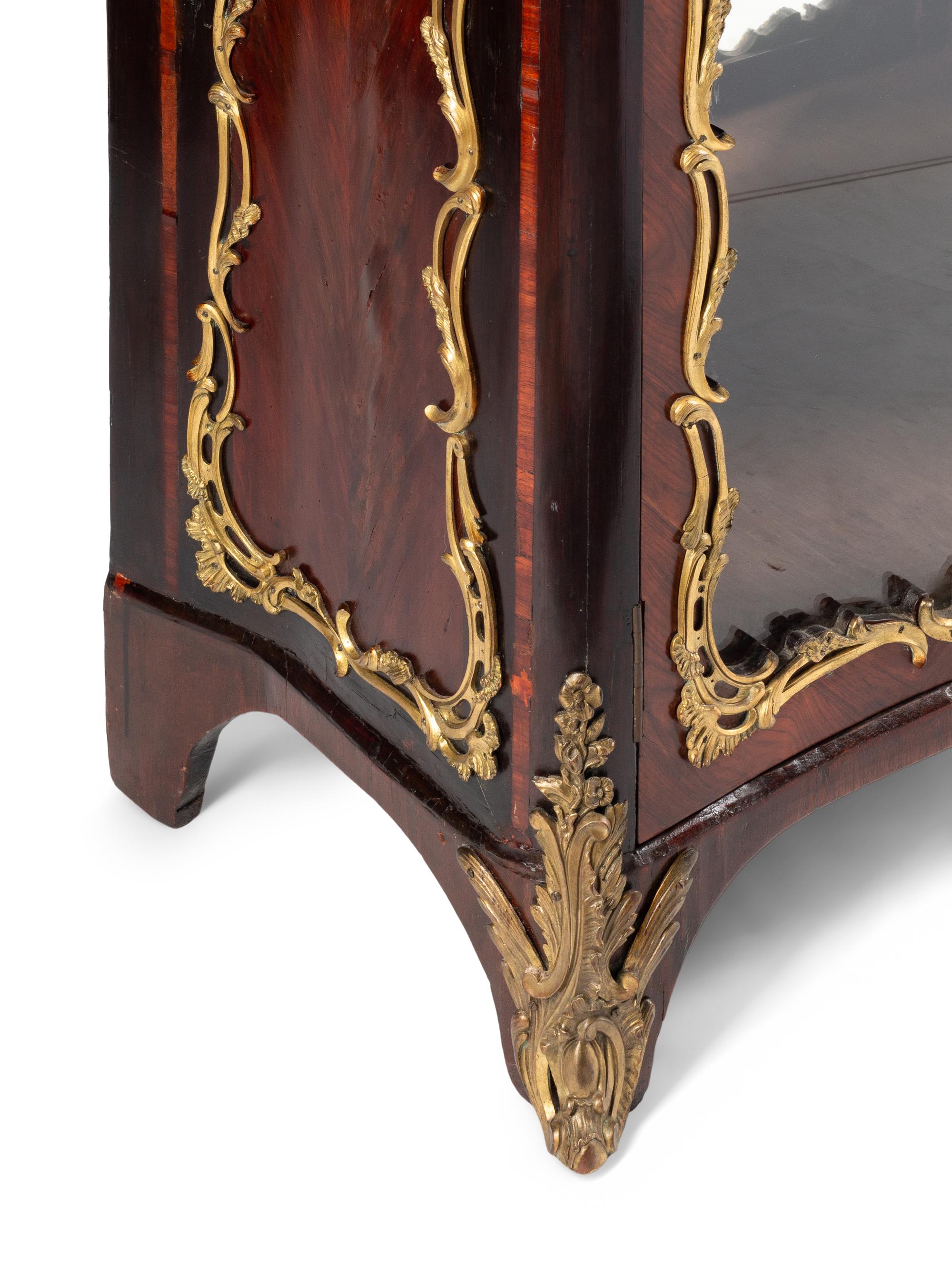 A Louis XV Style Gilt Bronze Mounted Kingwood Bookcase