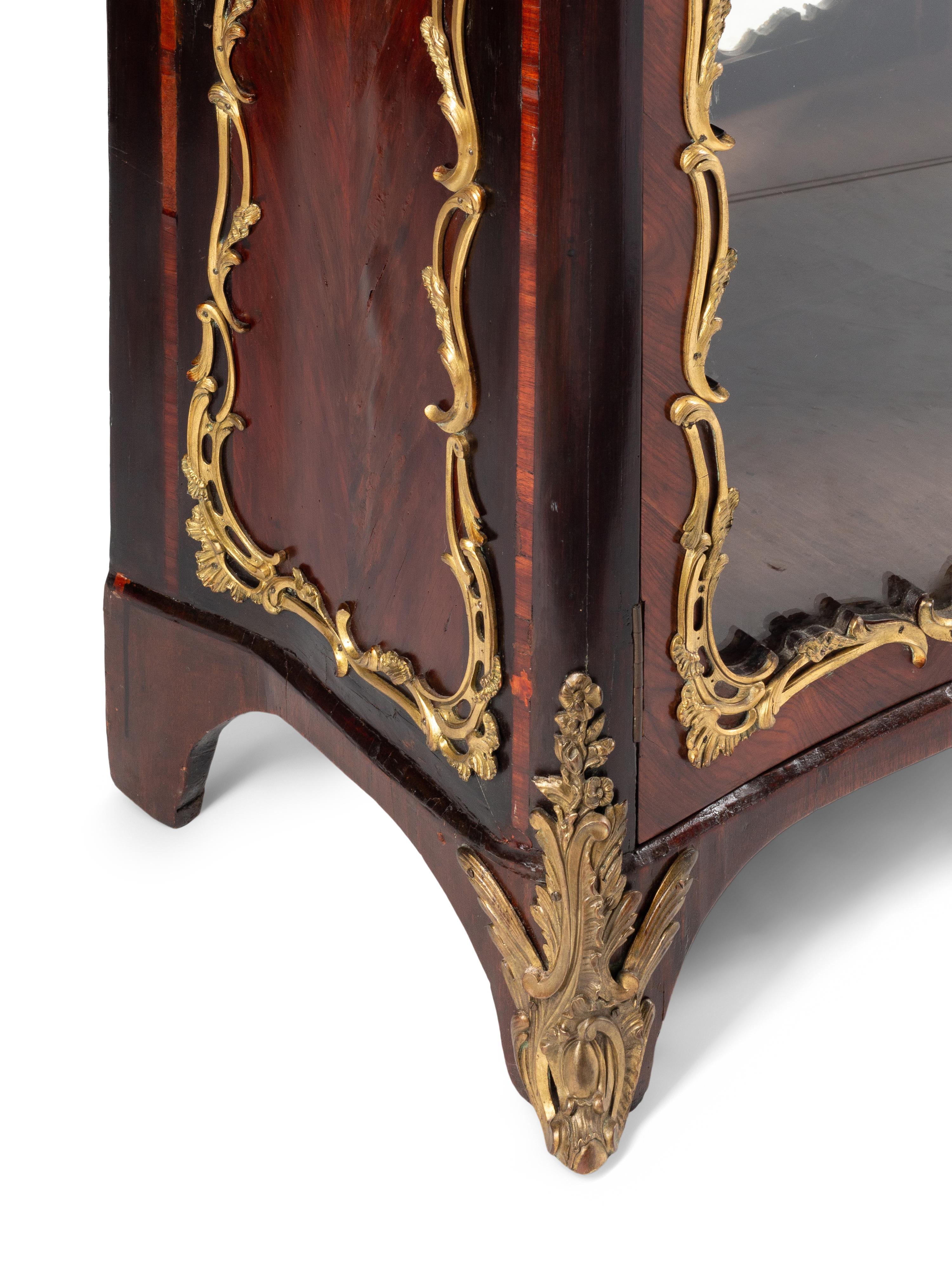 A Louis XV Style Gilt Bronze Mounted Kingwood Bookcase