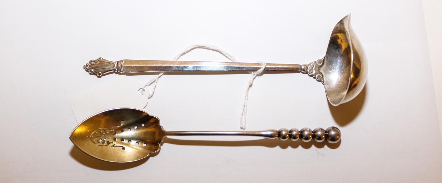 A Danish Silver Sauce Ladle, Georg Jensen, Copenhagen, 20th Century, in the Acanthus pattern, together with an American pierced spoon,