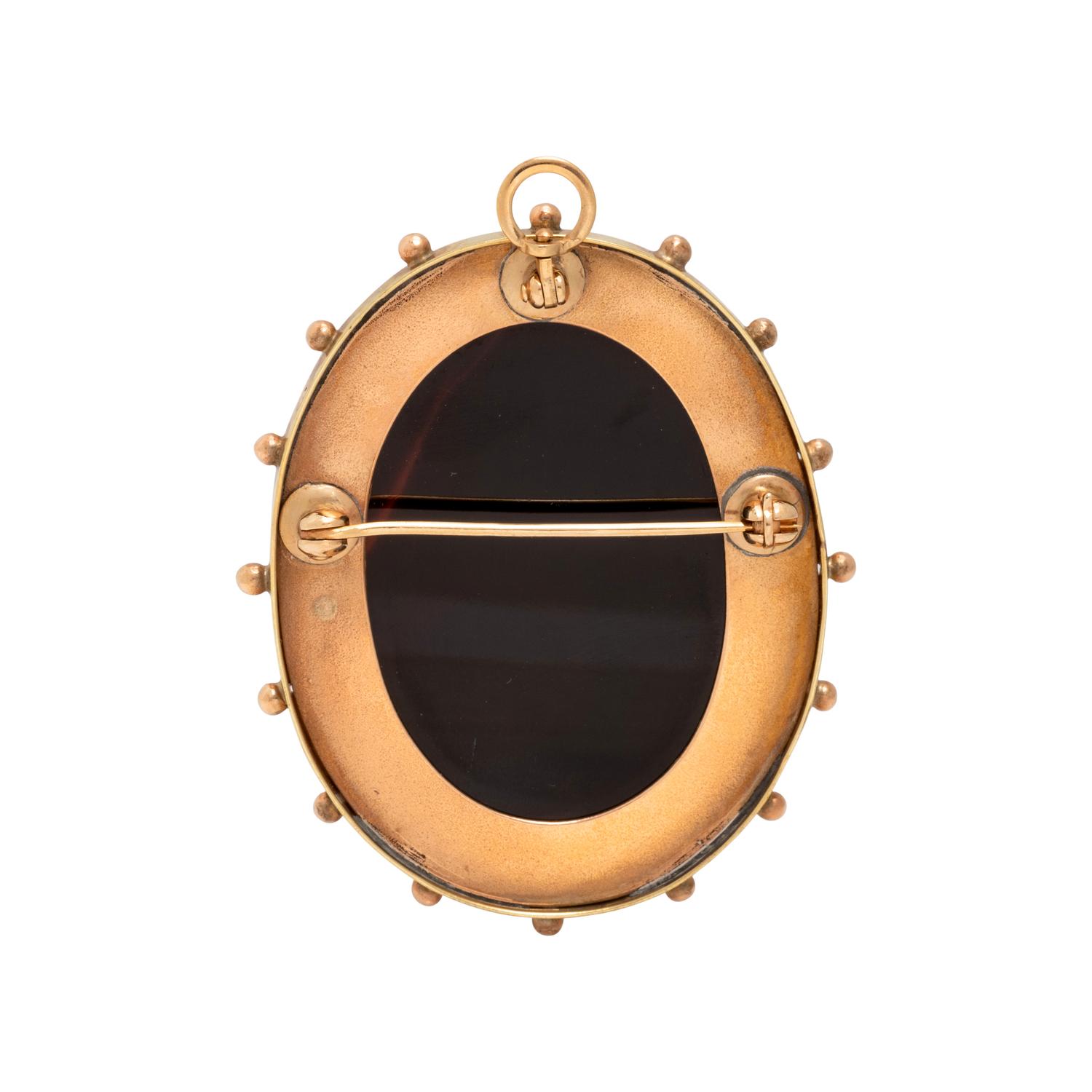 ANTIQUE, BICOLOR GOLD AND ONYX CAMEO PENDANT/BROOCH