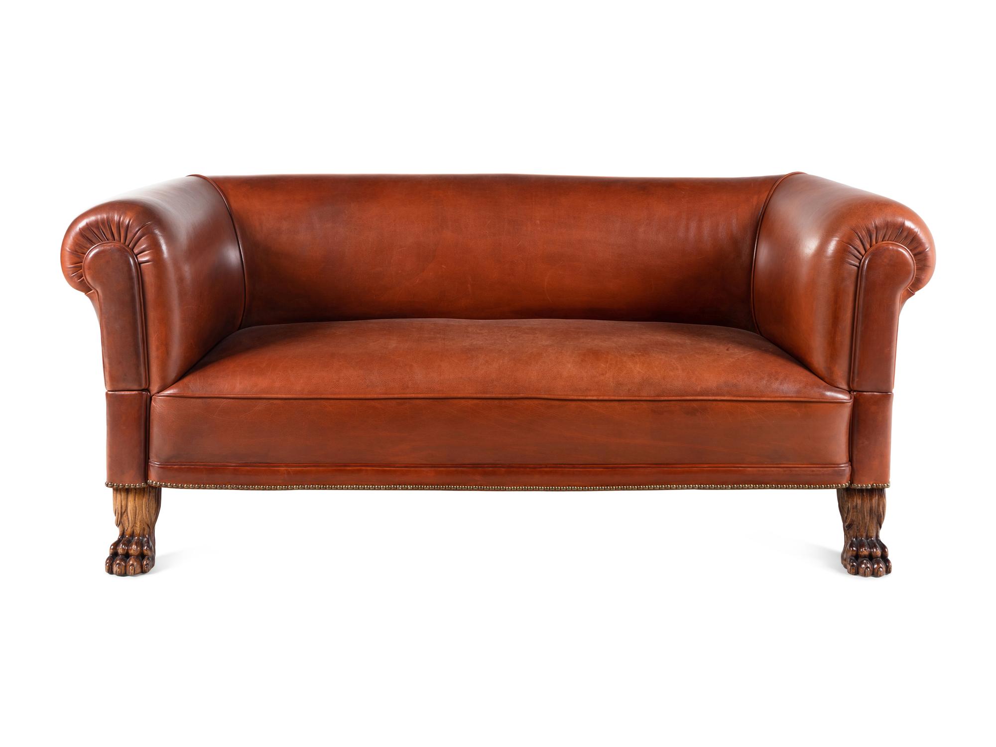 A Leather-Upholstered Mahogany Three-Piece Seating Suite