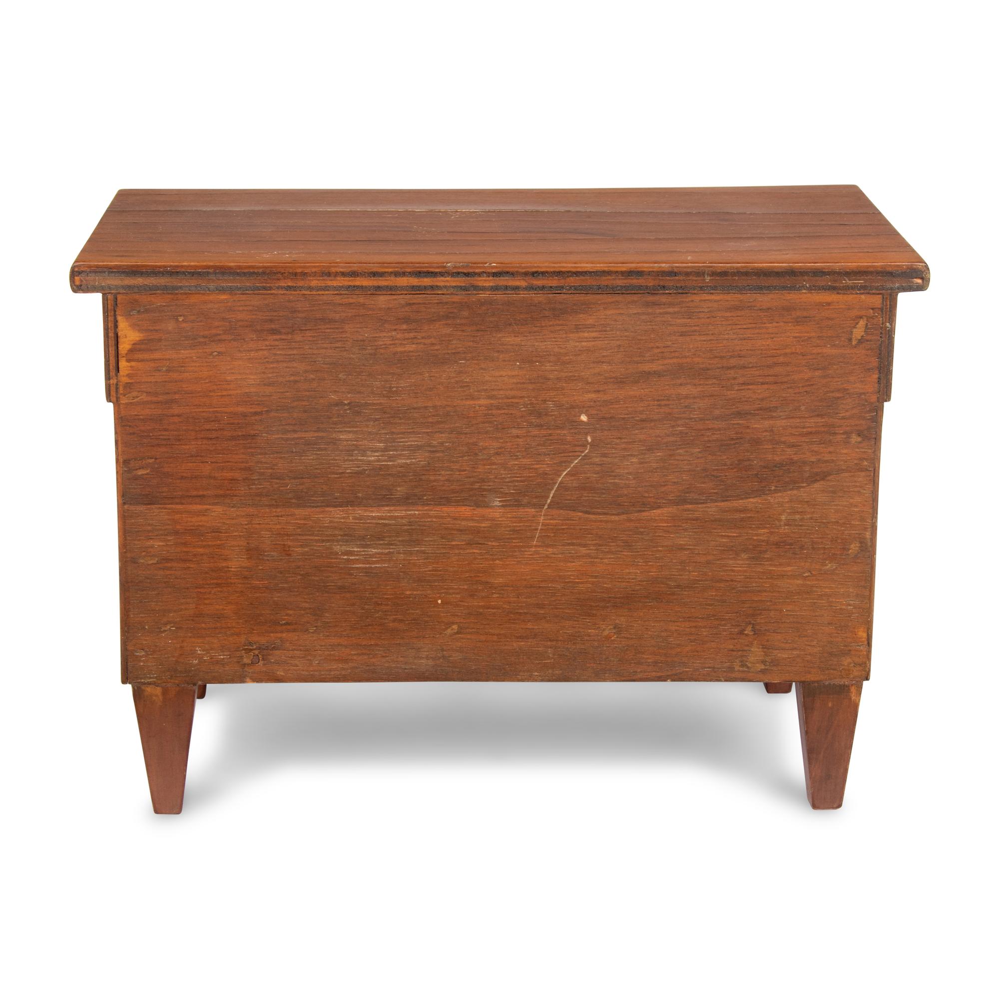 An Empire Style Diminutive Walnut Chest of Drawers