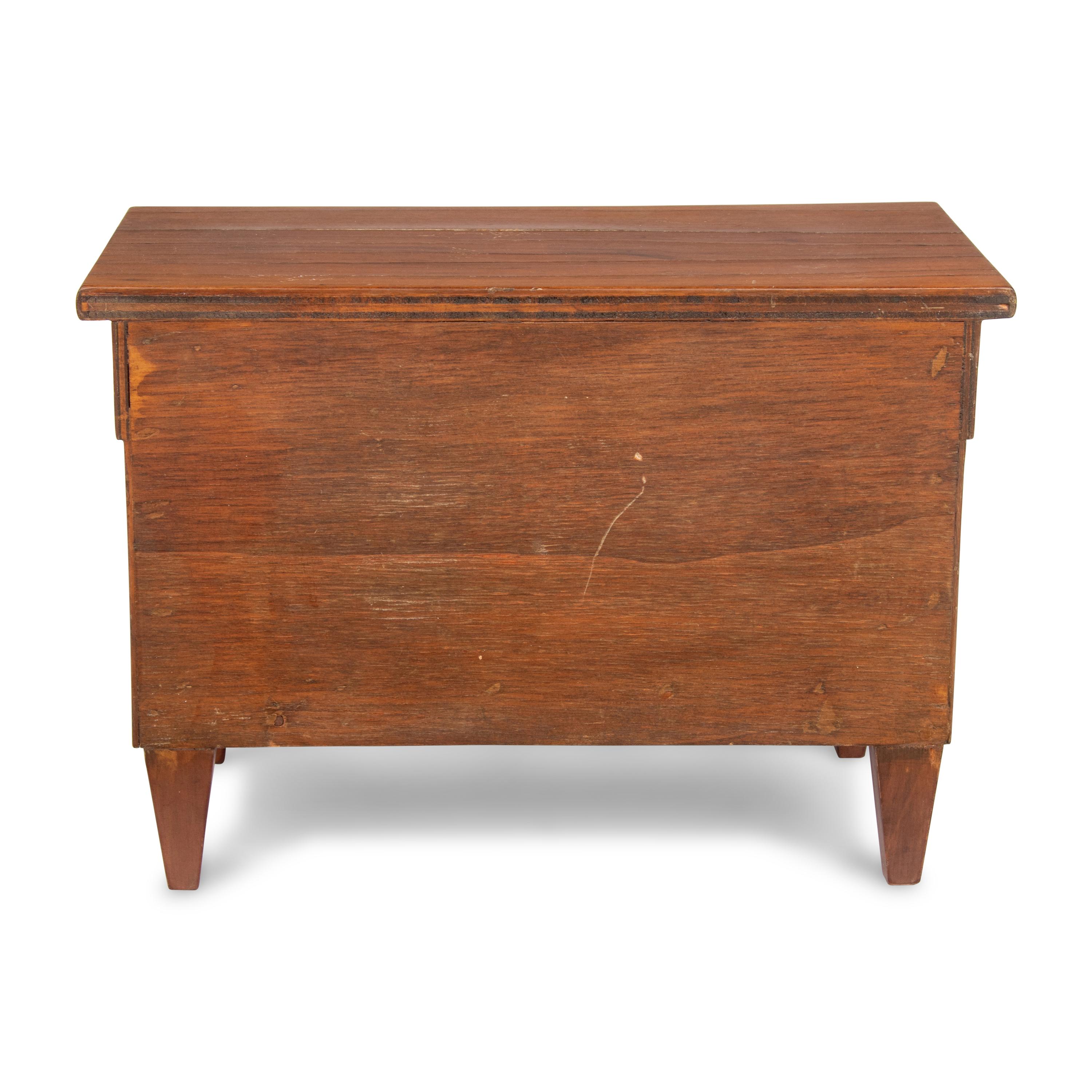 An Empire Style Diminutive Walnut Chest of Drawers