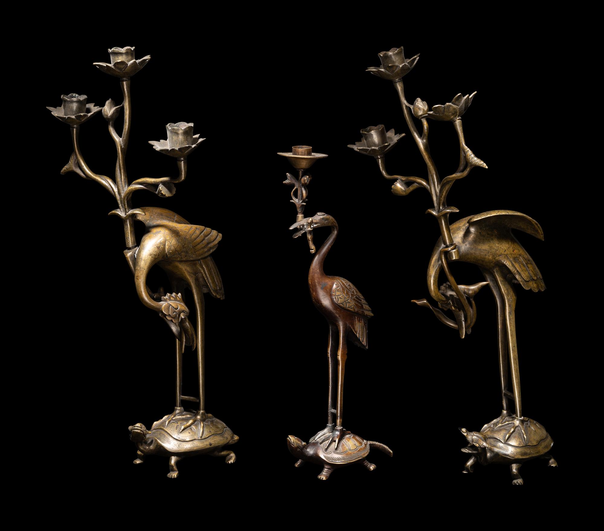 Three Chinese Bronze 'Turtle and Crane' Candle Holders