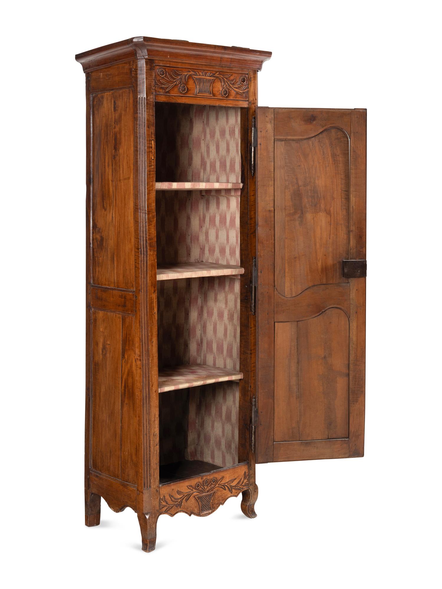 A Louis XV Provincial Walnut Cabinet