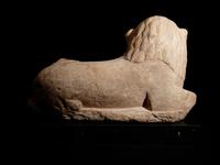 An Egyptian Limestone Recumbent Lion