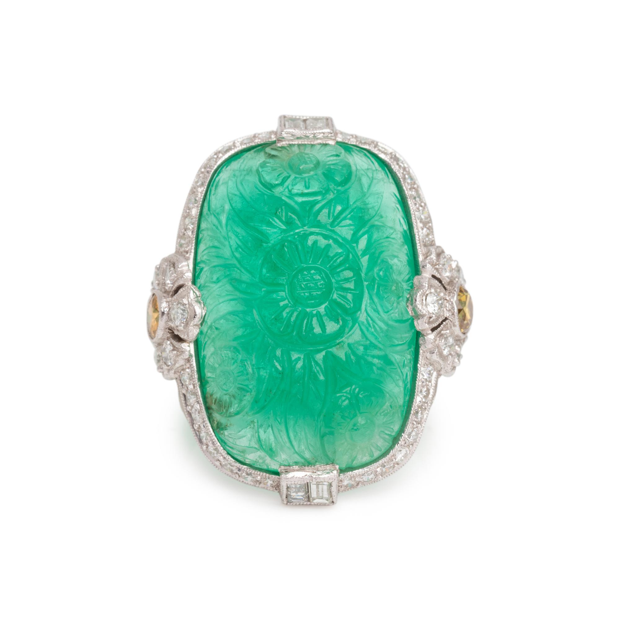 CARVED EMERALD, DIAMOND AND COLORED DIAMOND RING