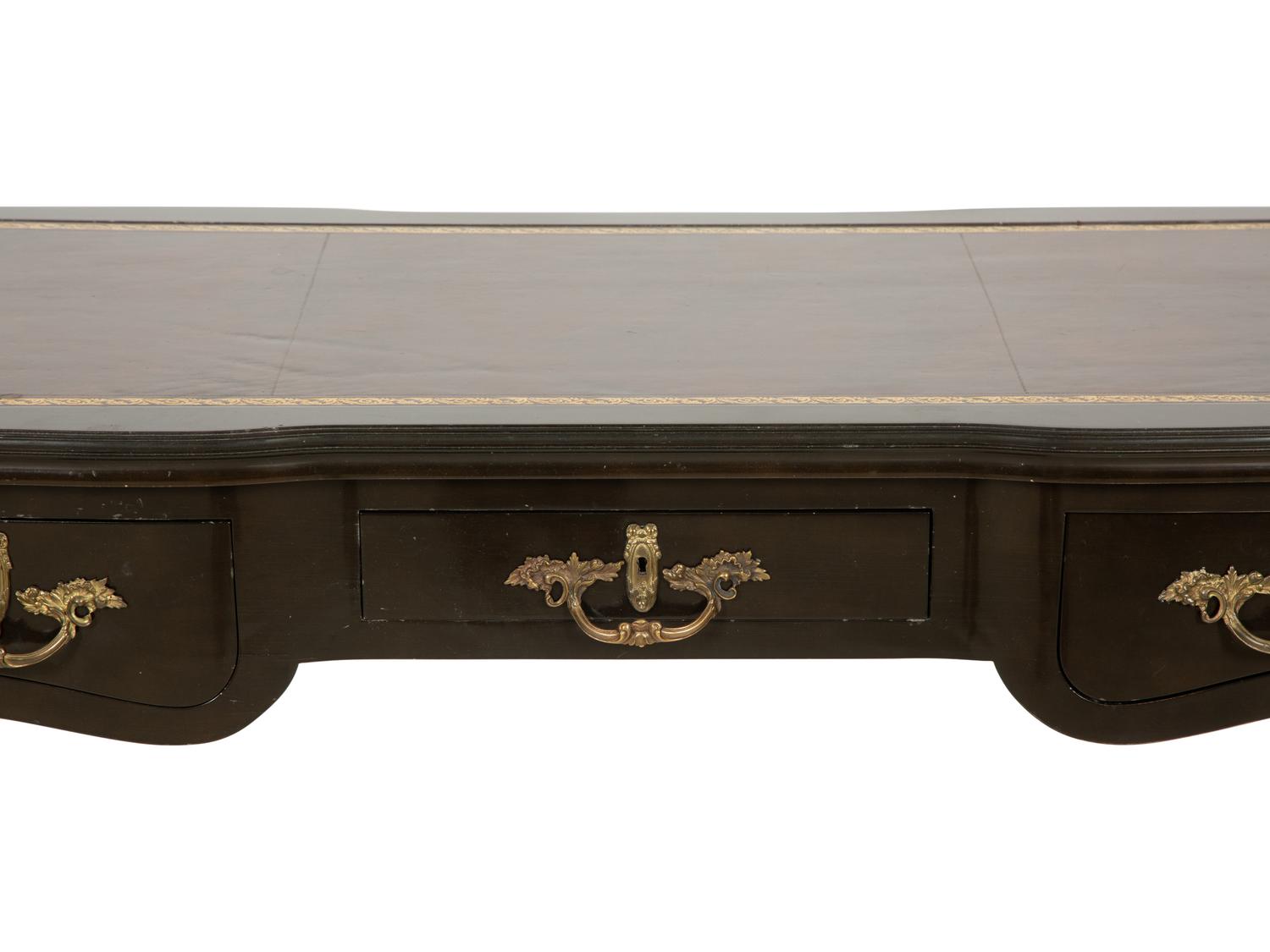 A Louis XV Style Gilt Metal-Mounted Ebonized Bureau Plat