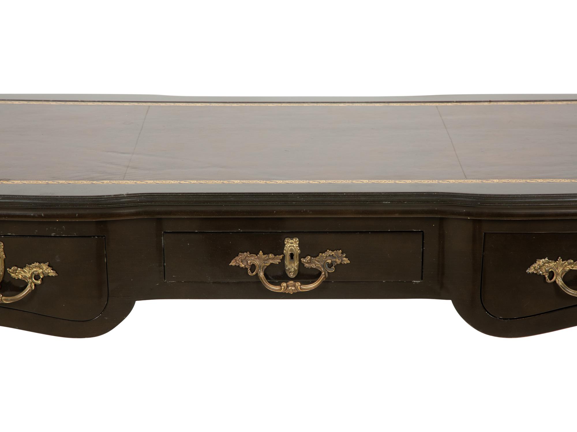A Louis XV Style Gilt Metal-Mounted Ebonized Bureau Plat
