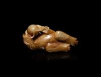 A Chinese Russet and Pale Celadon Jade Figure of a Boy