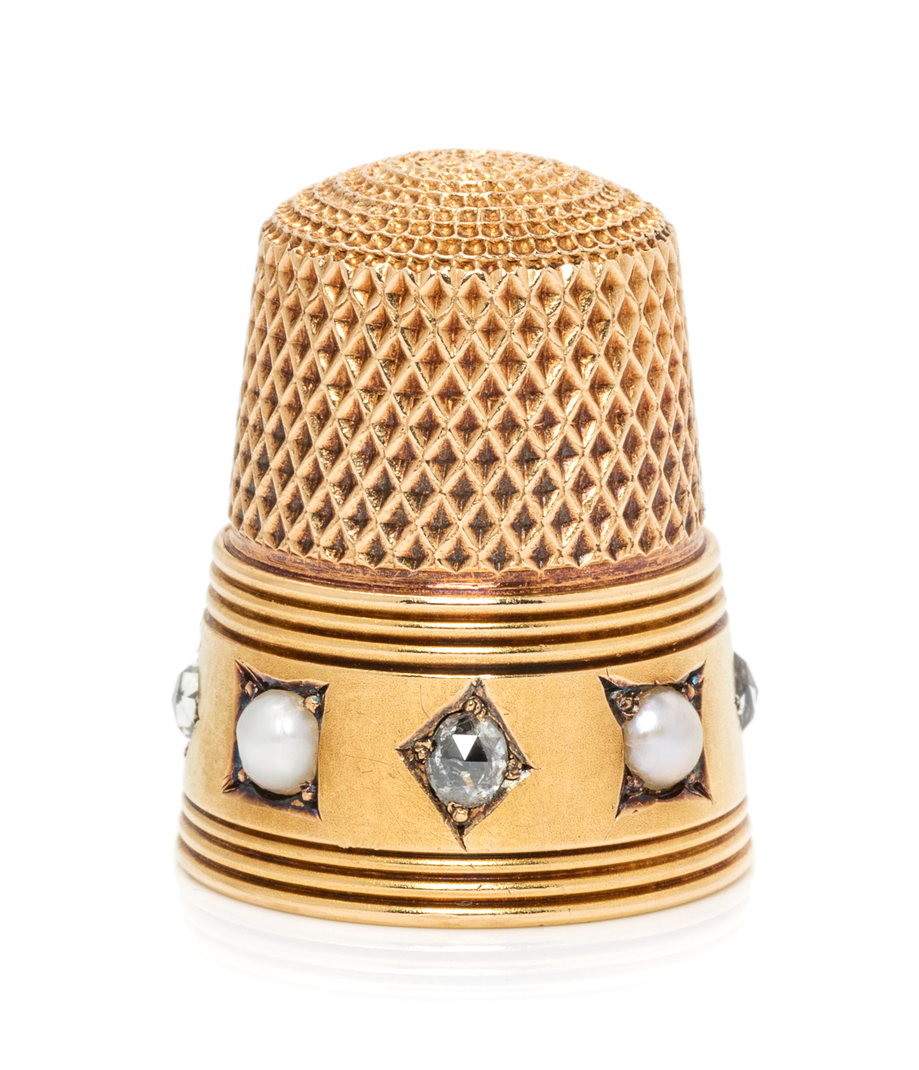 An American 18-Karat Yellow Gold, Diamond and Pearl Thimble, Possibly Tiffany & Co., New York, NY, the knurled top and body above the r