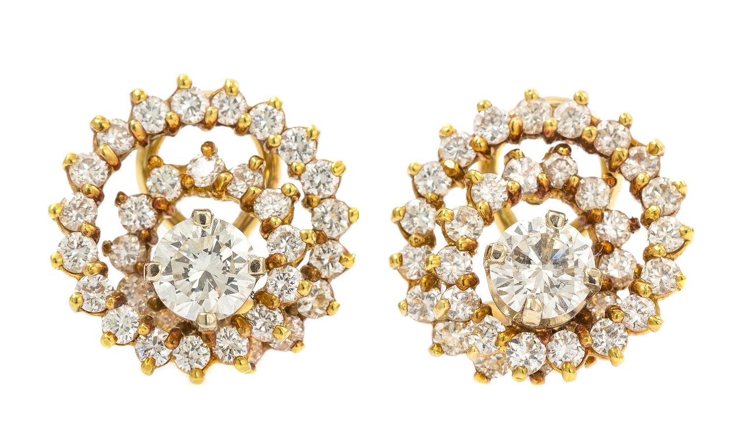 A Pair of 18 Karat Yellow Gold Diamond Swirl Earclips, 5.70 dwts.