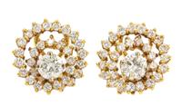 A Pair of 18 Karat Yellow Gold Diamond Swirl Earclips, 5.70 dwts.