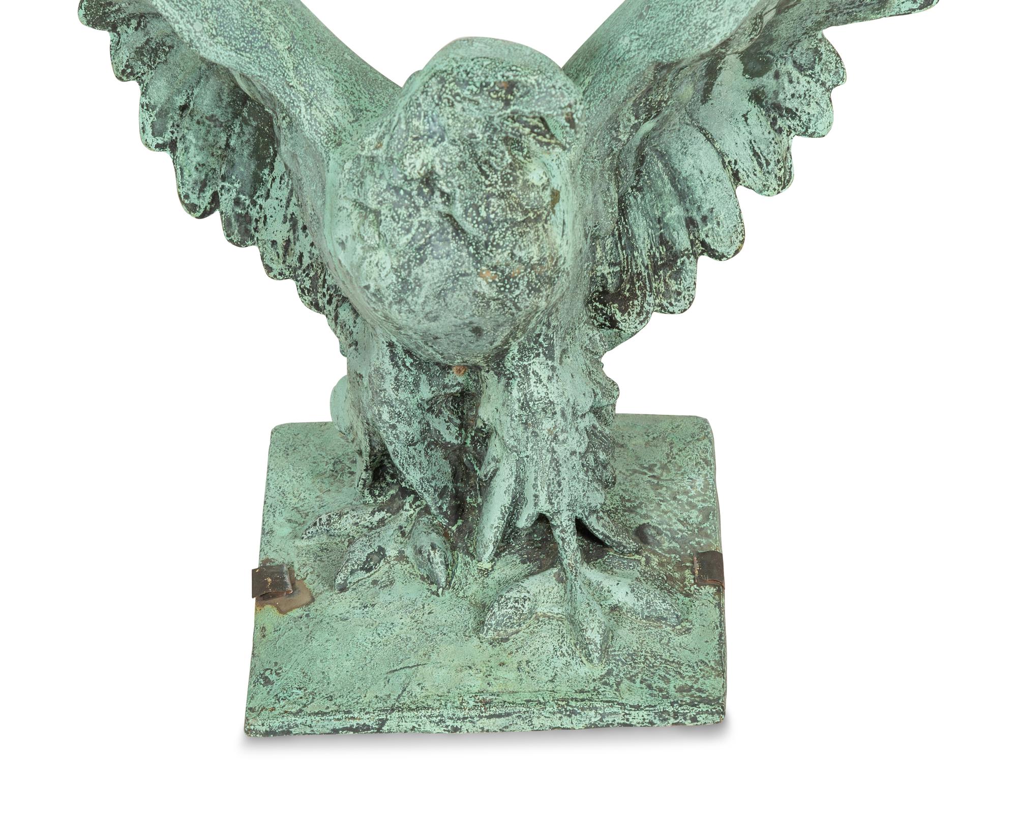 A Patinated Cast Metal Eagle Architectural Ornament with Verdigris Patina