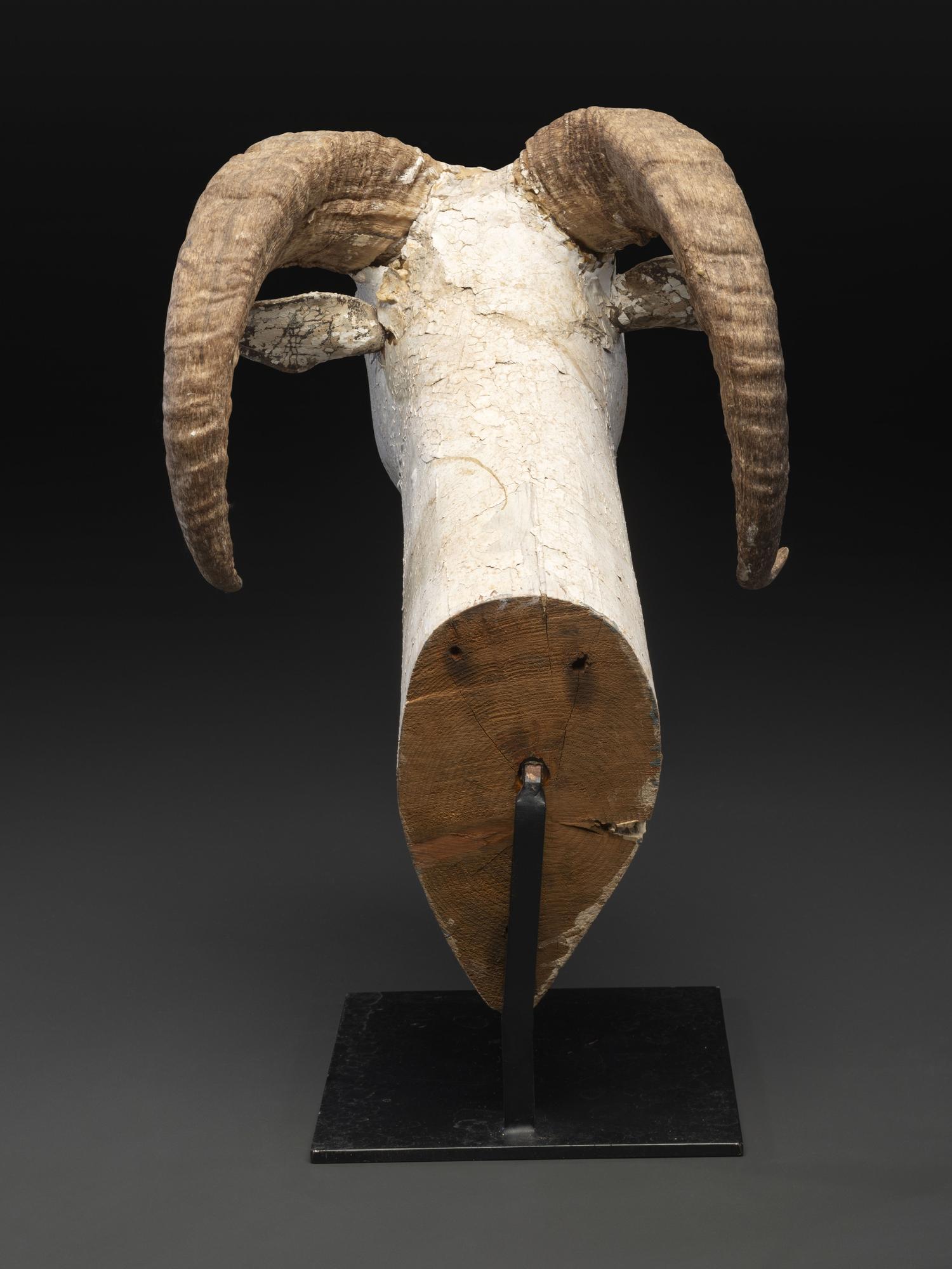 A Folk Art Carved and Painted Wood Ram's Head