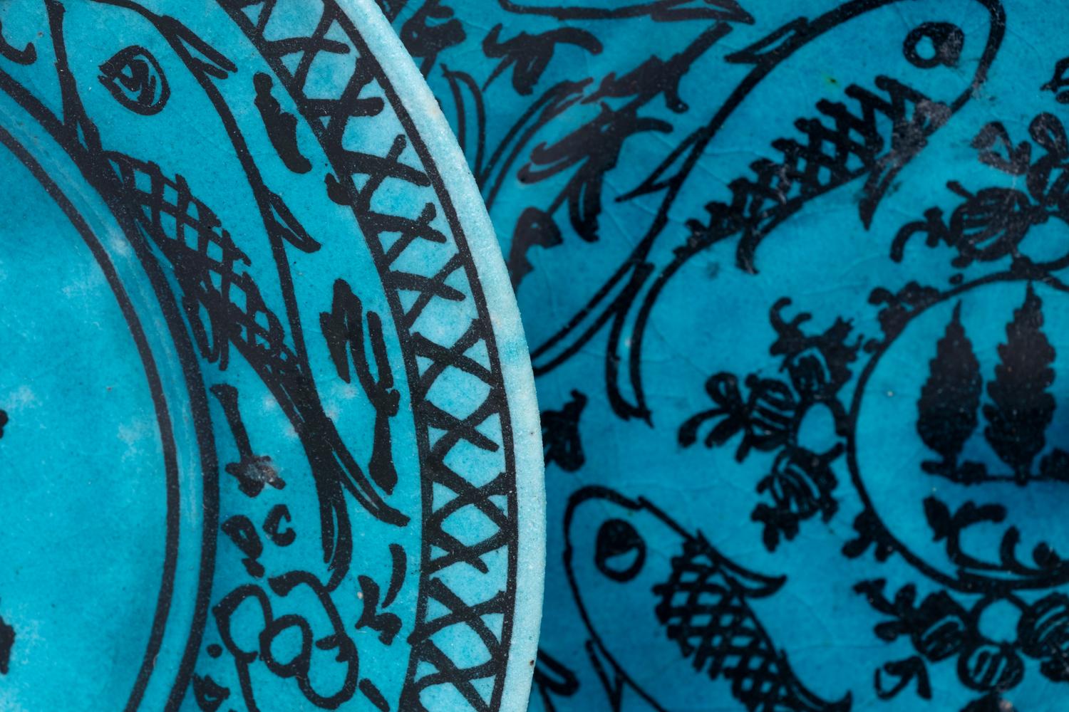 A Set of Four Persian Turquoise Glazed Earthenware Plates