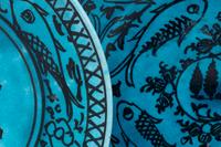 A Set of Four Persian Turquoise Glazed Earthenware Plates