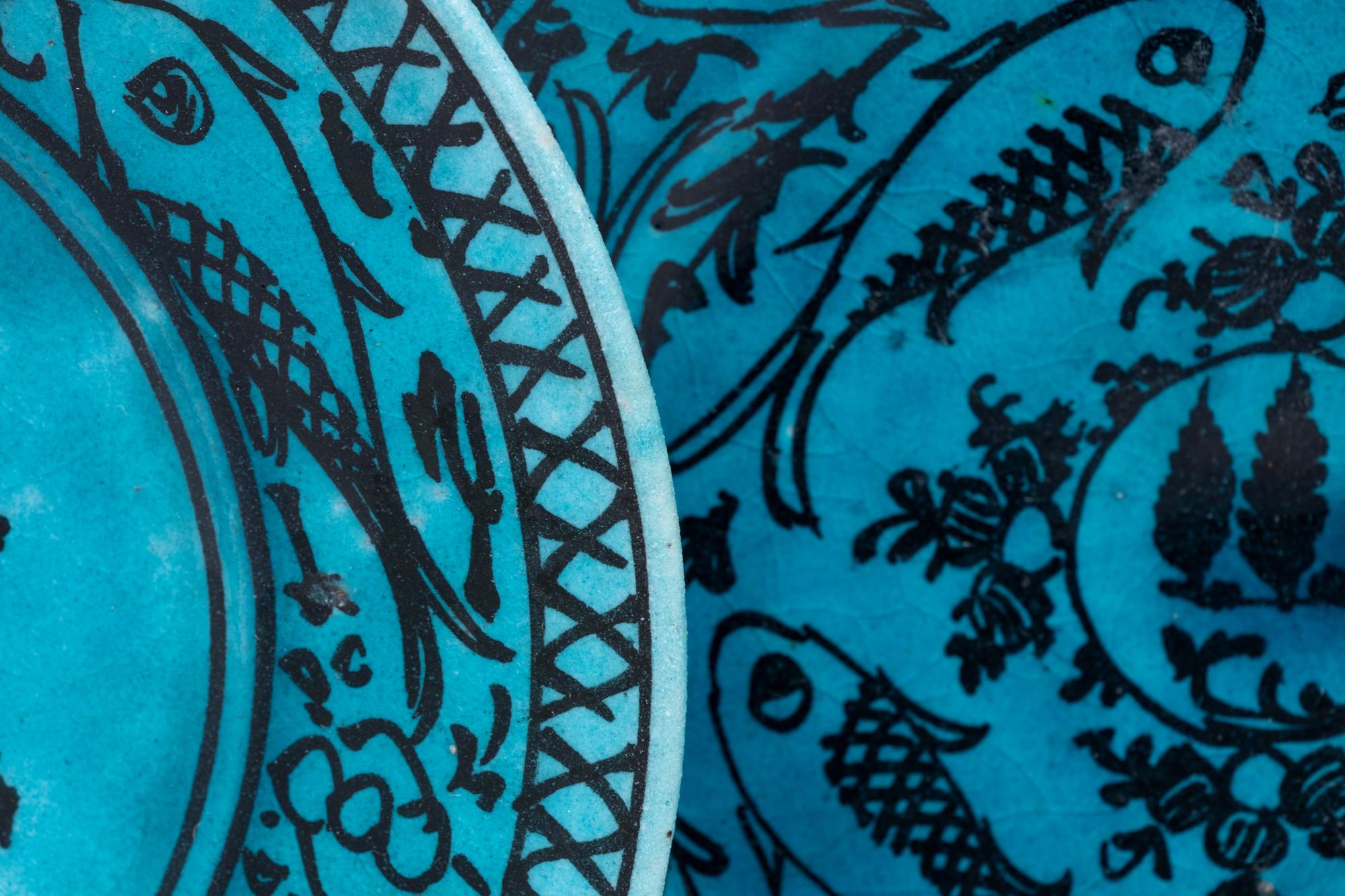 A Set of Four Persian Turquoise Glazed Earthenware Plates