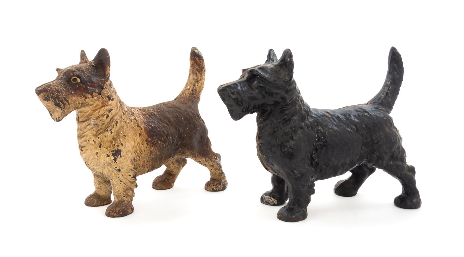 Two Cast Iron Figures Height 8 1/4 inches.