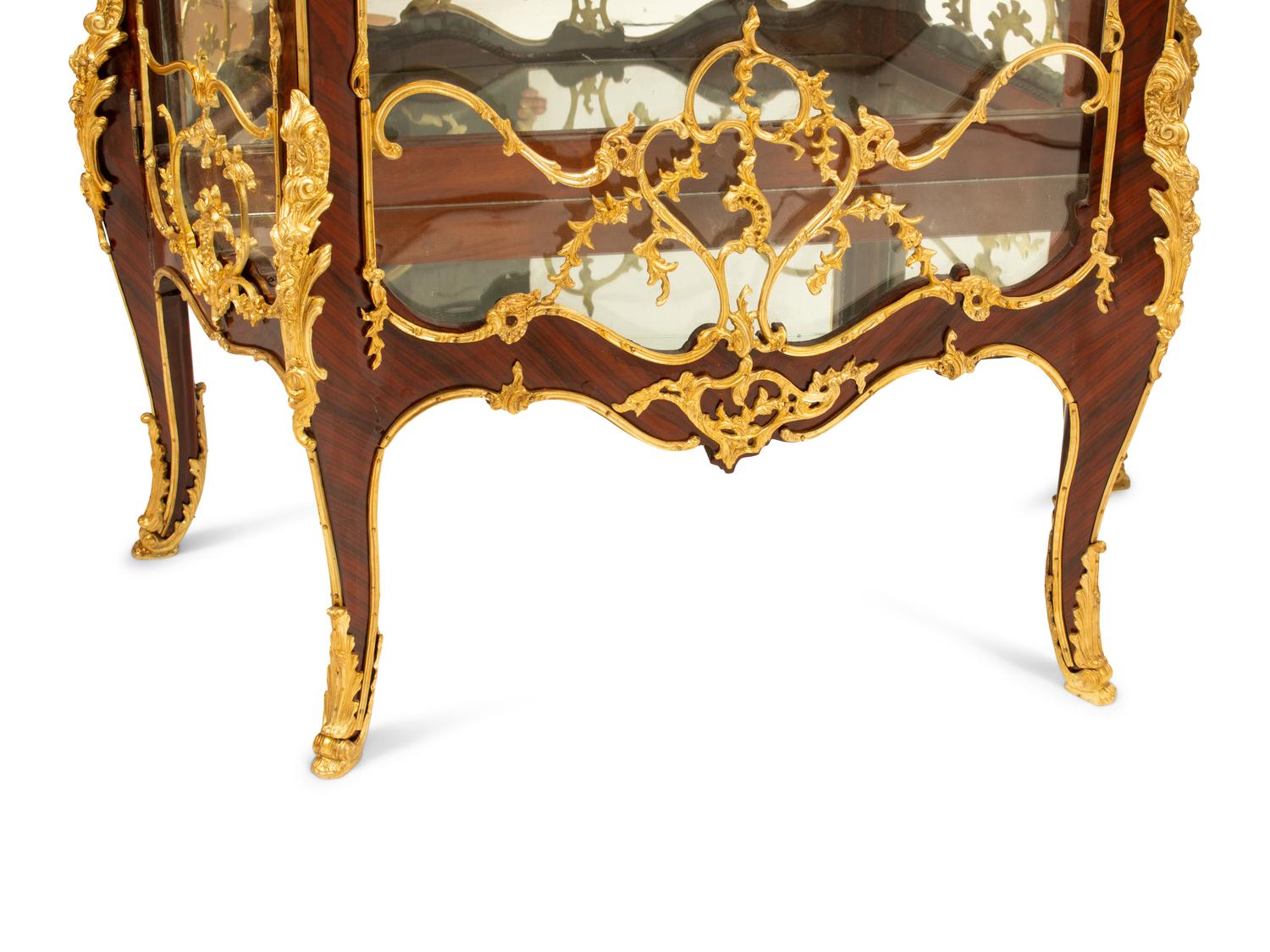 A Pair of Louis XV Style Gilt Bronze Mounted Vitrine Cabinets