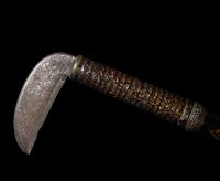 A Japanese Iron and Lacquered Wood Sickle