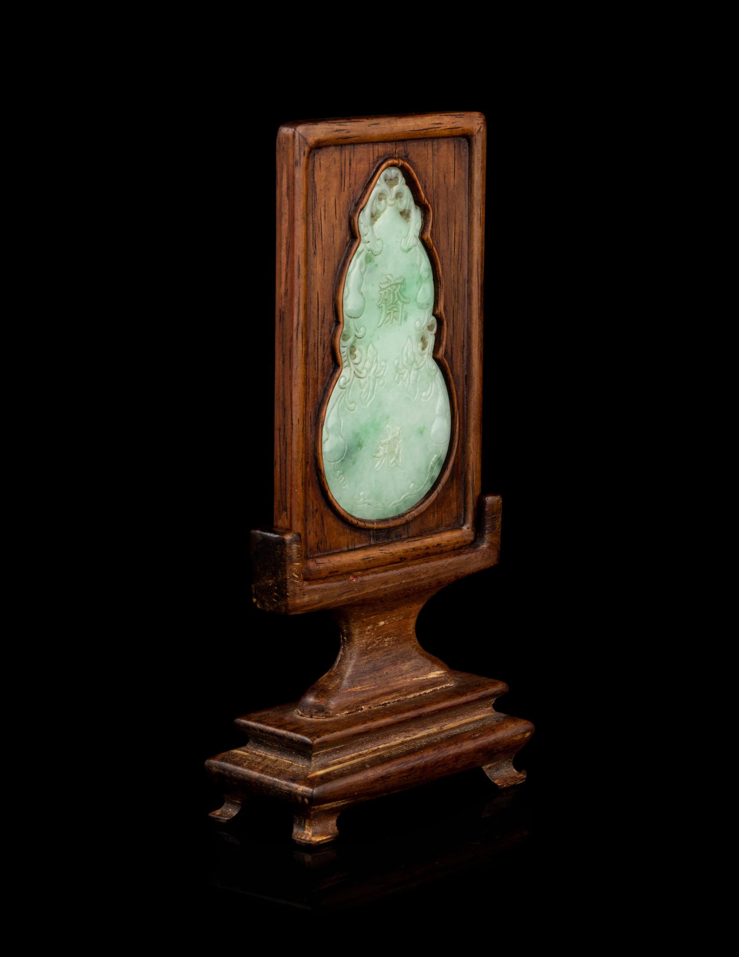 An Apple Green and Pale Celadon Jadeite Inset Hardwood Table Screen