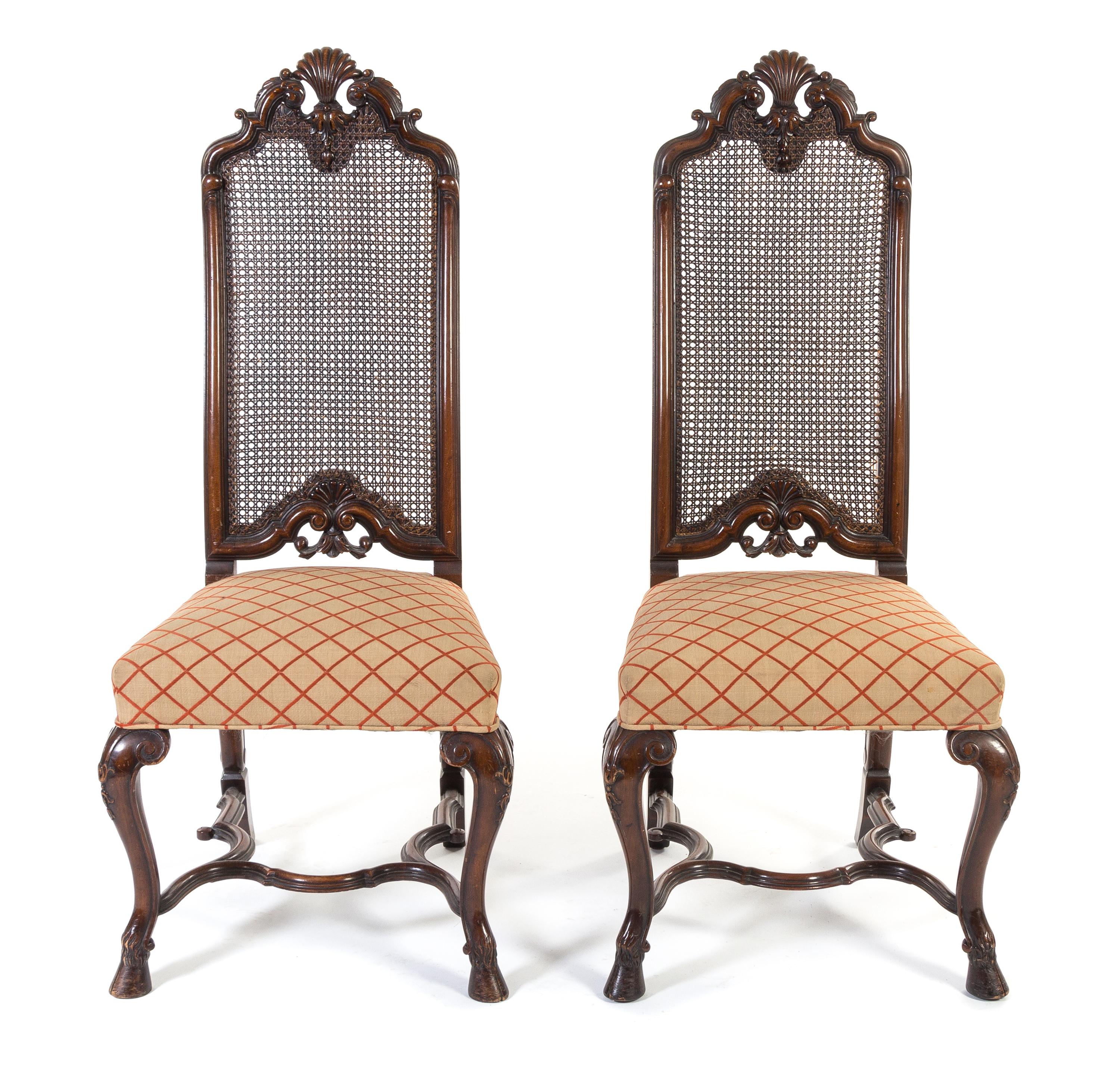 A Pair of Renaissance Revival Walnut Hall Chairs Height 46 1/2 inches. — 20TH CENTURY