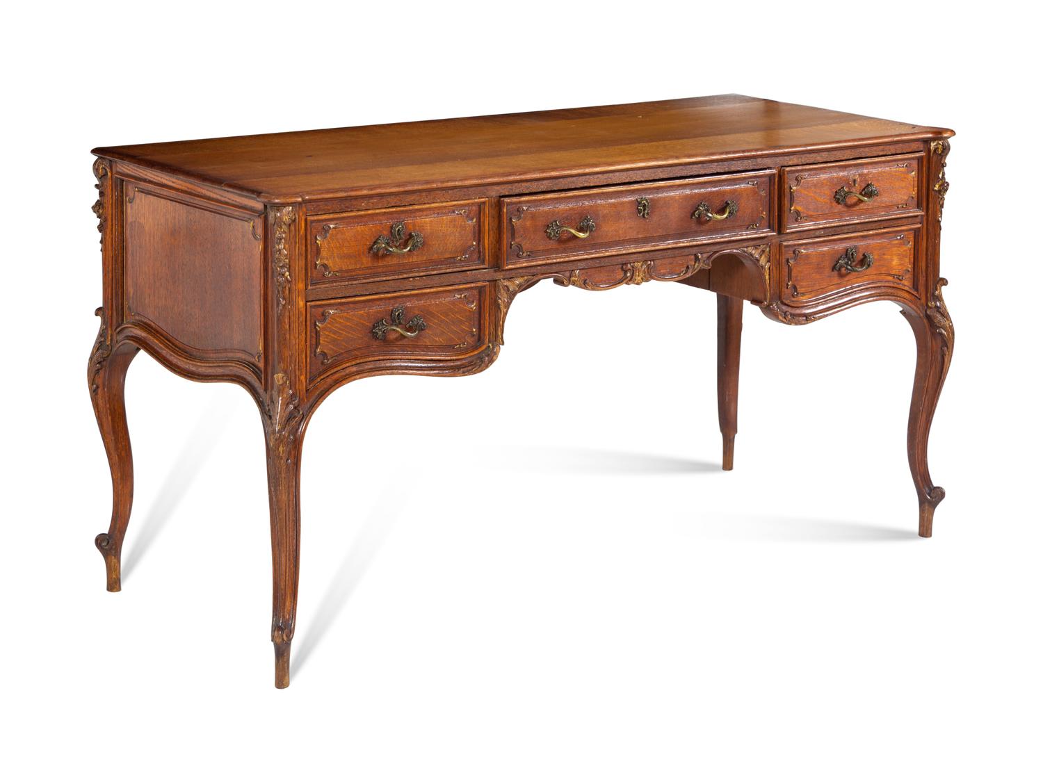 A Louis XV Style Parcel Gilt Oak Bureau Plat