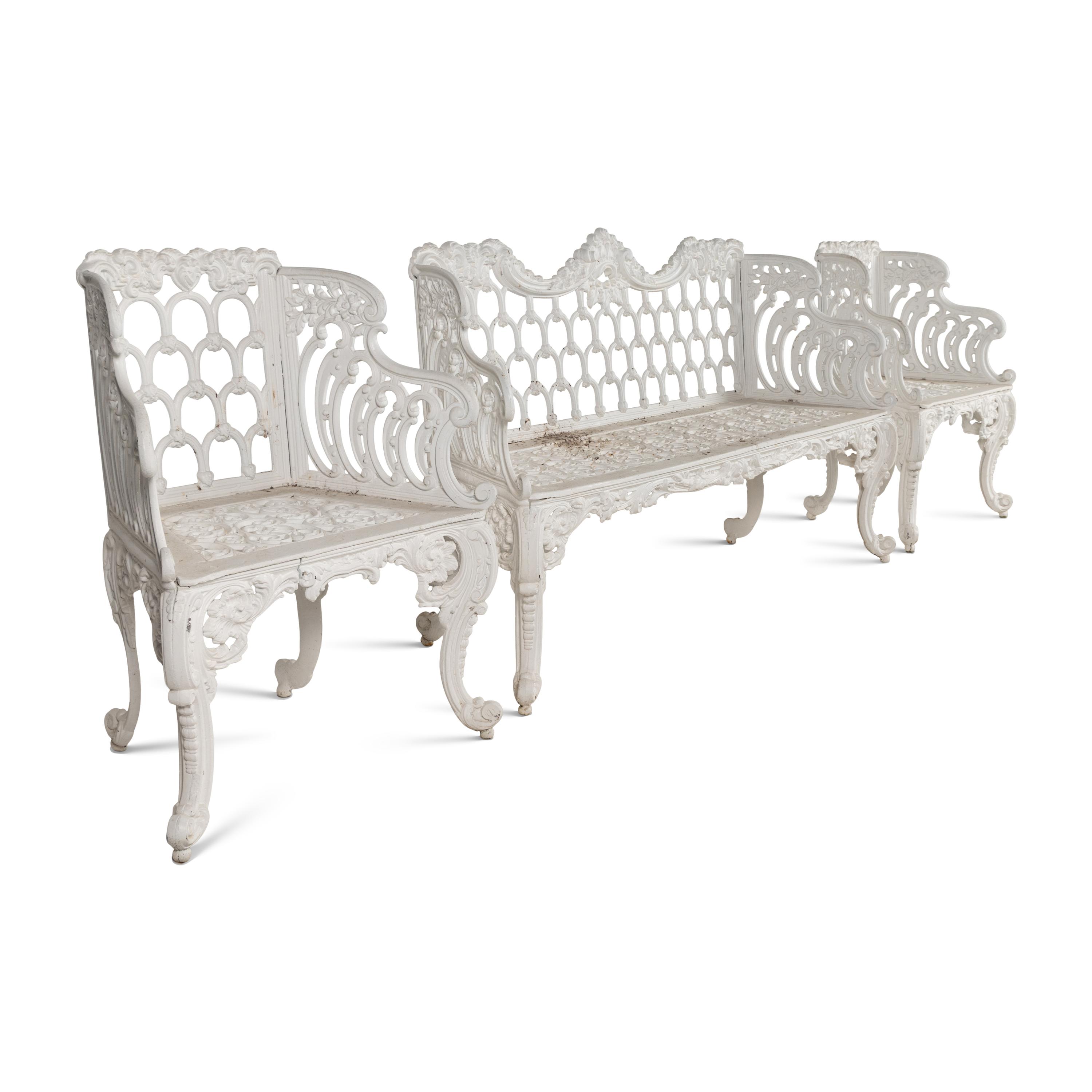 A White-Painted Cast Iron Three-Piece Garden Seating Suite