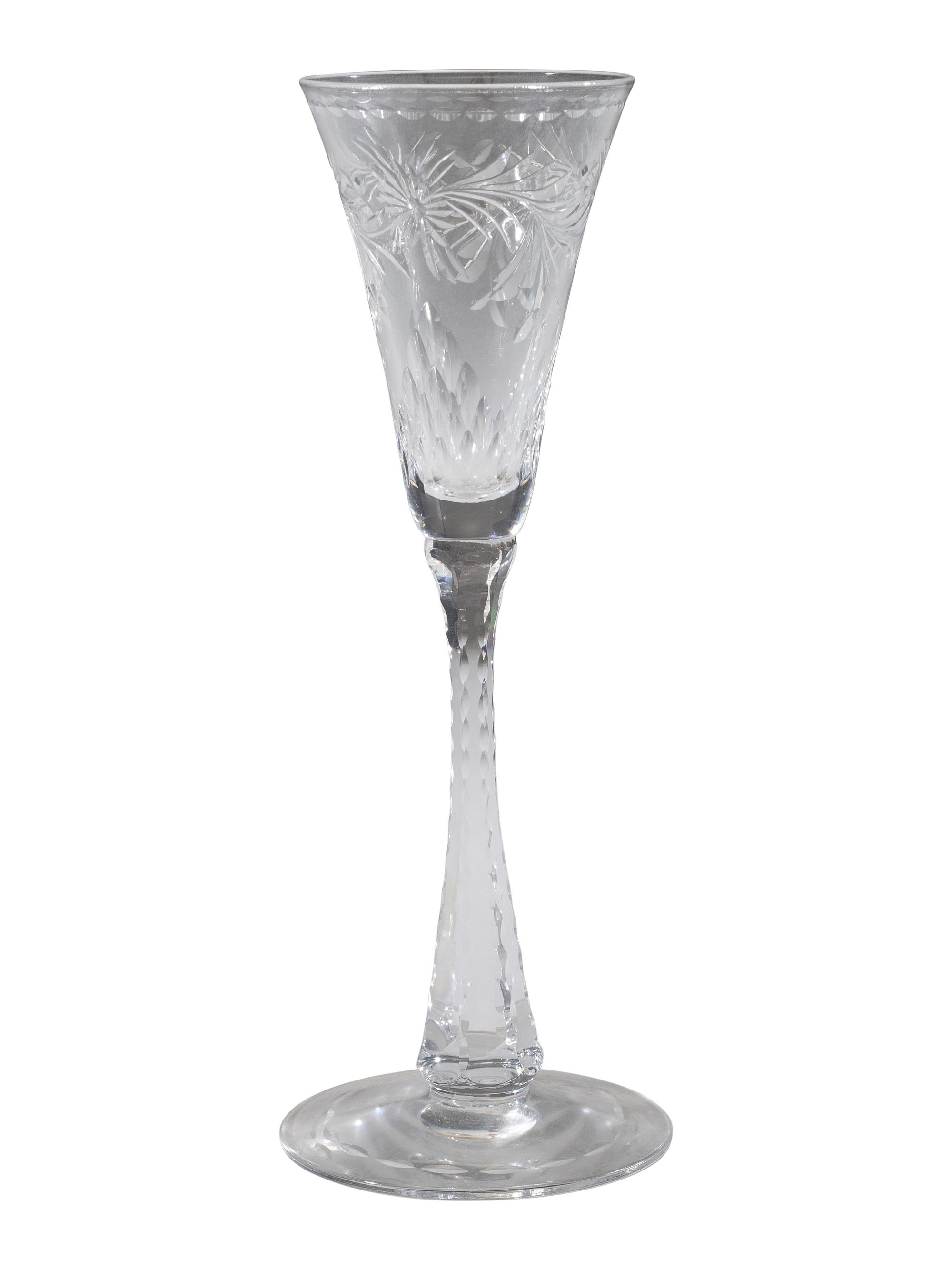 A Collection of Cut Glass Stemware and Plates
