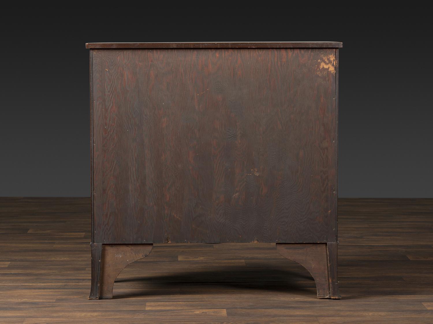 A Federal Inlaid and Figured Mahogany Bow-Front Chest of Drawers