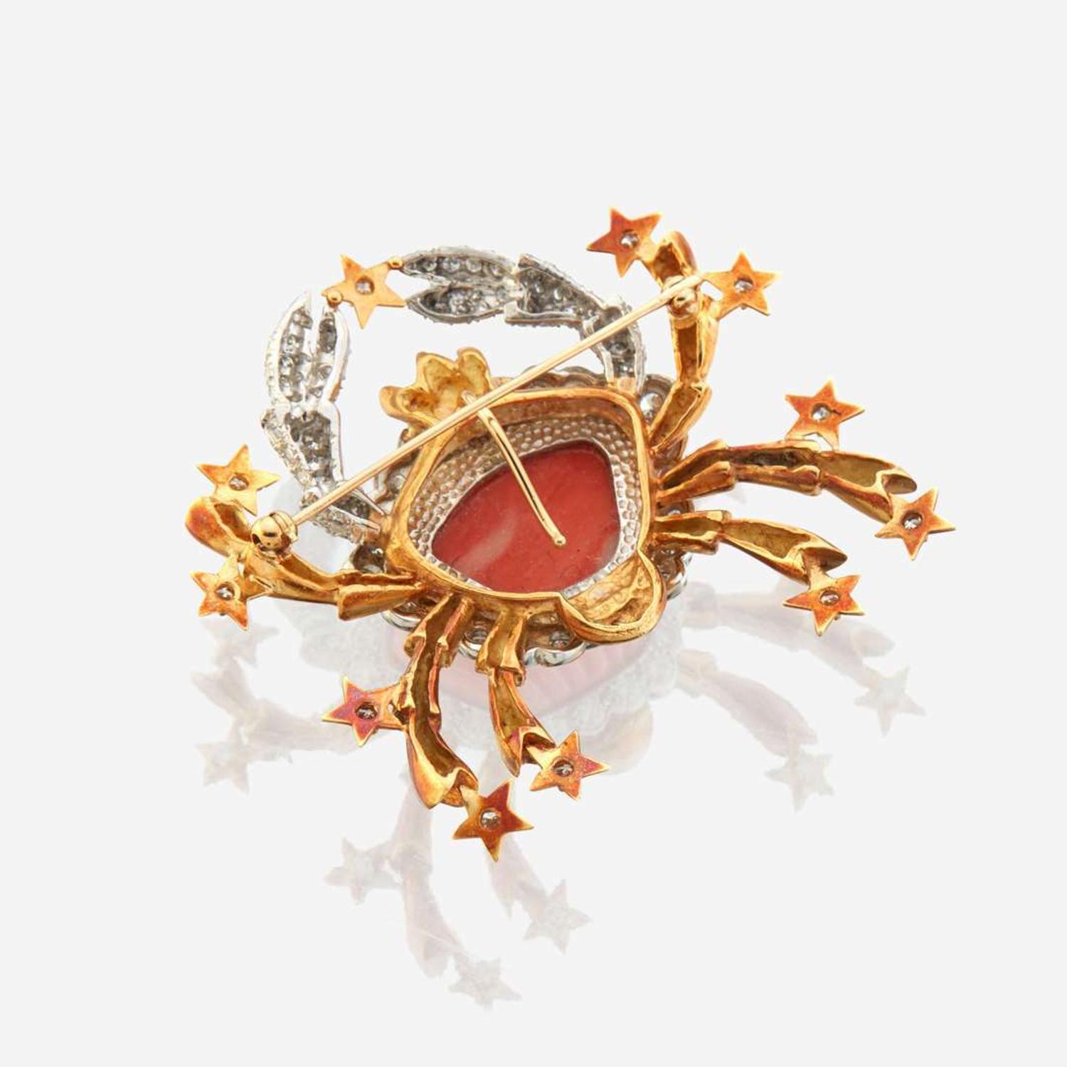 A coral, diamond, and bicolor gold pendant/brooch