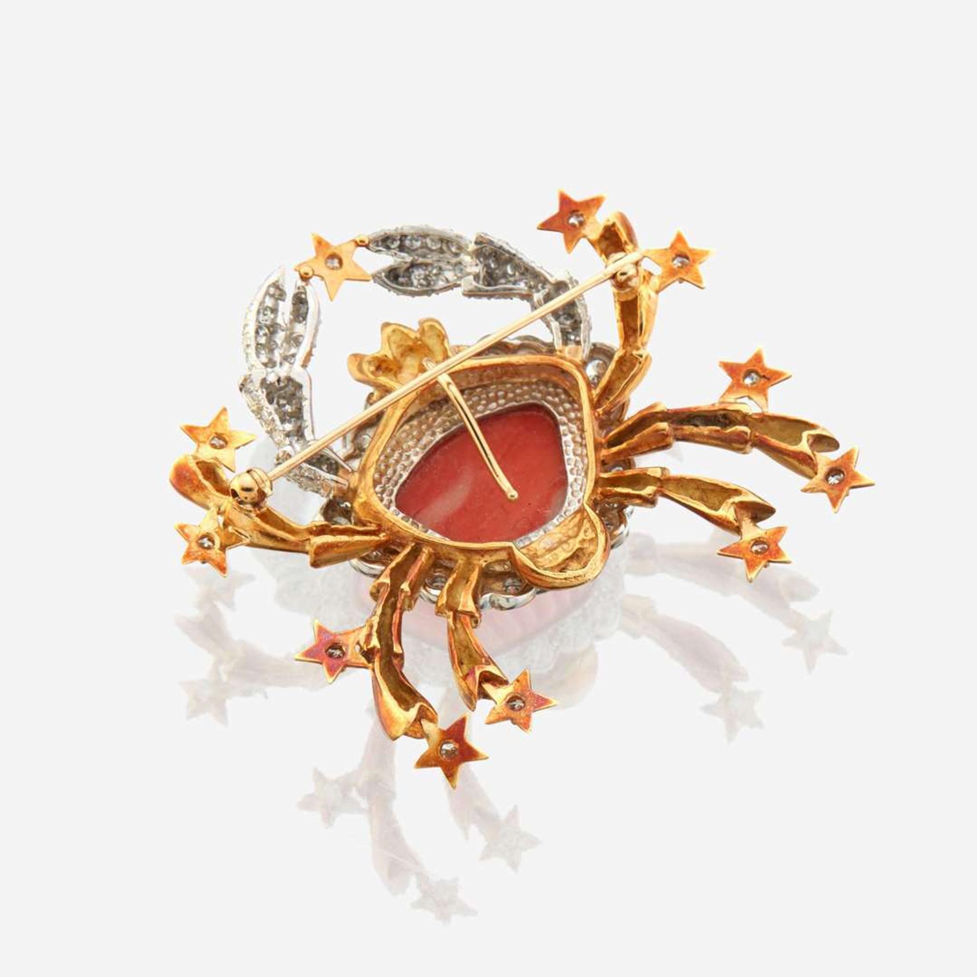 A coral, diamond, and bicolor gold pendant/brooch