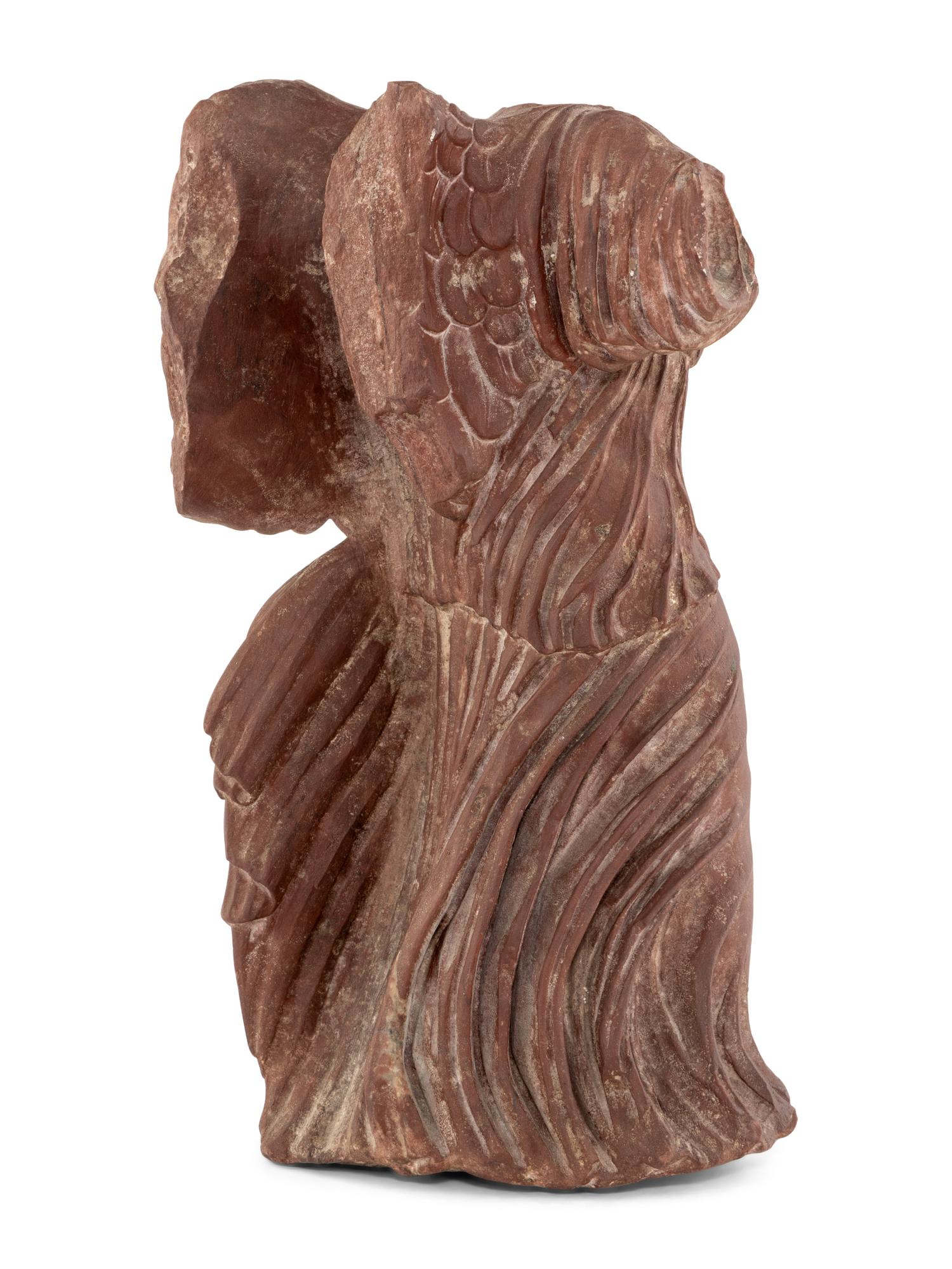 A Carved Red Marble Figure of the Nike of Samothrace