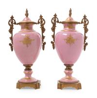 A Pair of Gilt Bronze Mounted Sèvres Style Porcelain Covered Urns