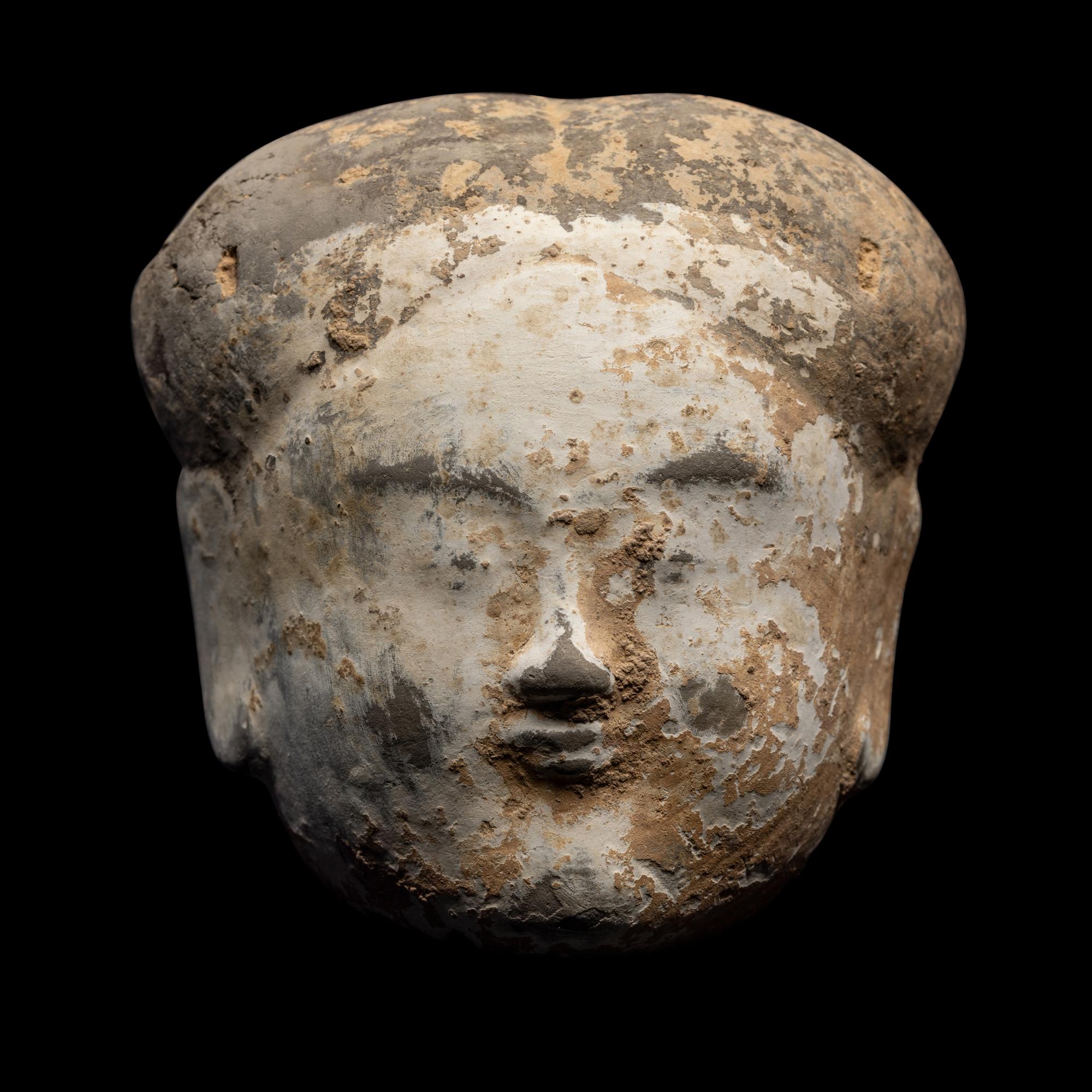A Chinese Pottery Head of an Attendant
