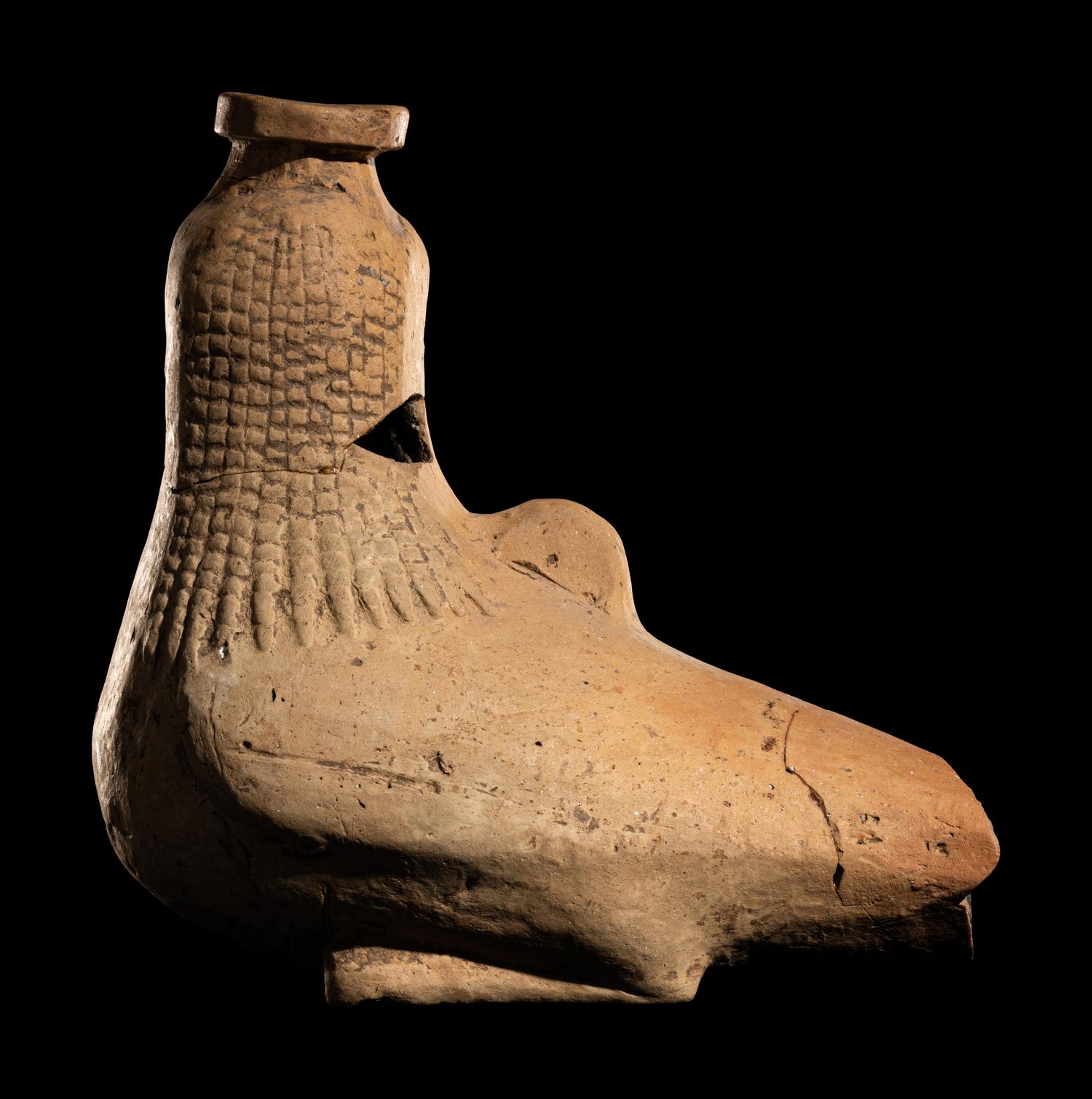 A Rhodian Pottery Figural Vessel in the Form of a Siren