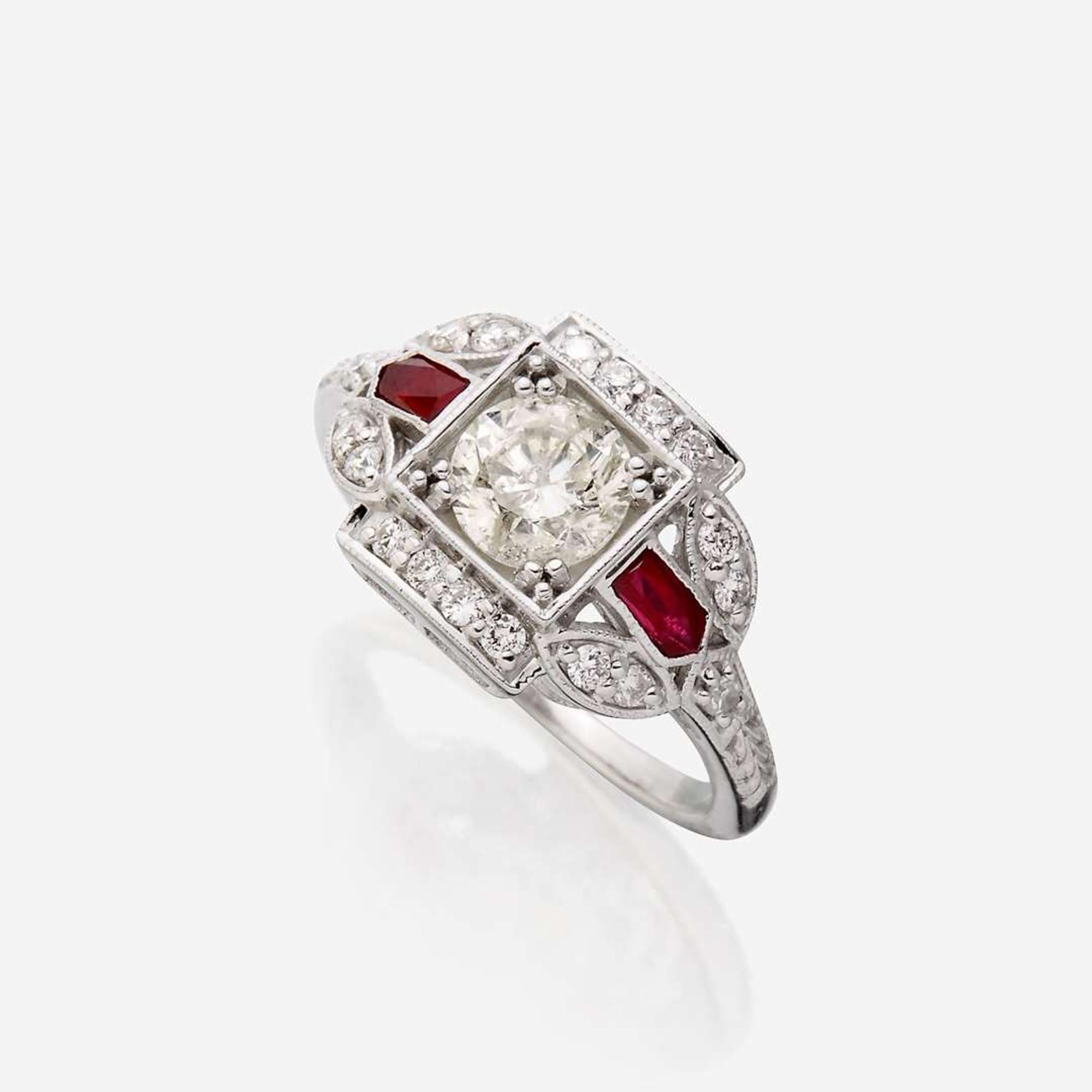 A diamond, ruby, and eighteen karat white gold ring