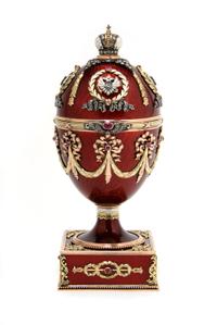 A Russian Jeweled, Tricolor Gold and Guilloche Enameled Egg, Height 5 1/2 inches.